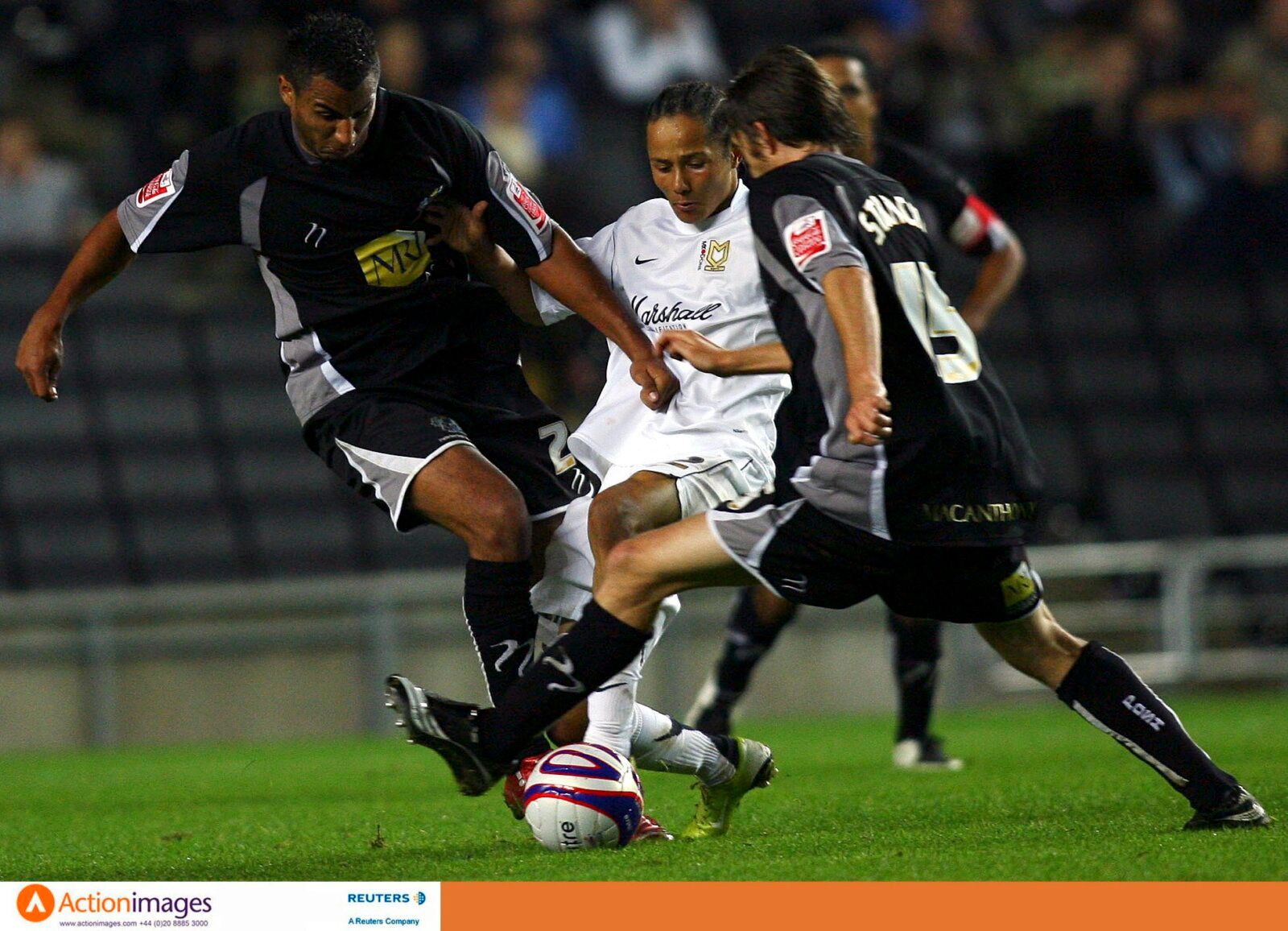 Football - Milton Keynes Dons v Peterborough United Johnstone's Paint Trophy Southern Section Second Round  - Stadium MK - 9/10/07 
Peterborough's Rene Howe (L) and Gavin Strachan (R) in action against MK Dons' Bally Smart (C) 
Mandatory Credit: Action Images / Andrew Boyers 
Livepic