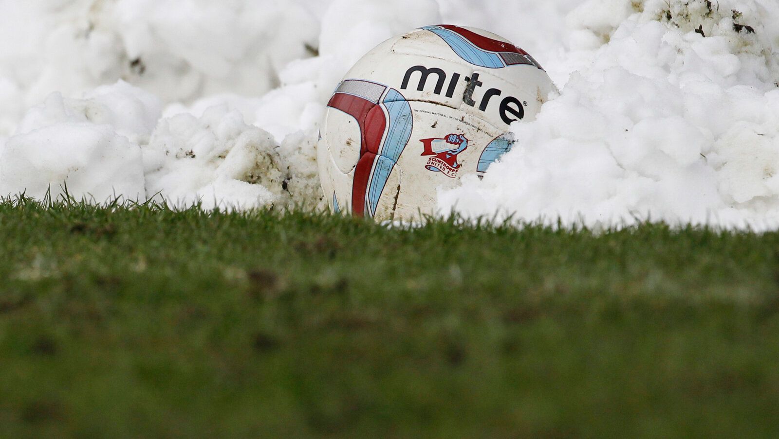 Football - Scunthorpe United v Doncaster Rovers - npower Football League One - Glanford Park - 23/3/13 
General view of the Mitre match ball buried in snow 
Mandatory Credit: Action Images / Craig Brough 
Livepic 
EDITORIAL USE ONLY. No use with unauthorized audio, video, data, fixture lists, club/league logos or live services. Online in-match use limited to 45 images, no video emulation. No use in betting, games or single club/league/player publications.  Please contact your account representat