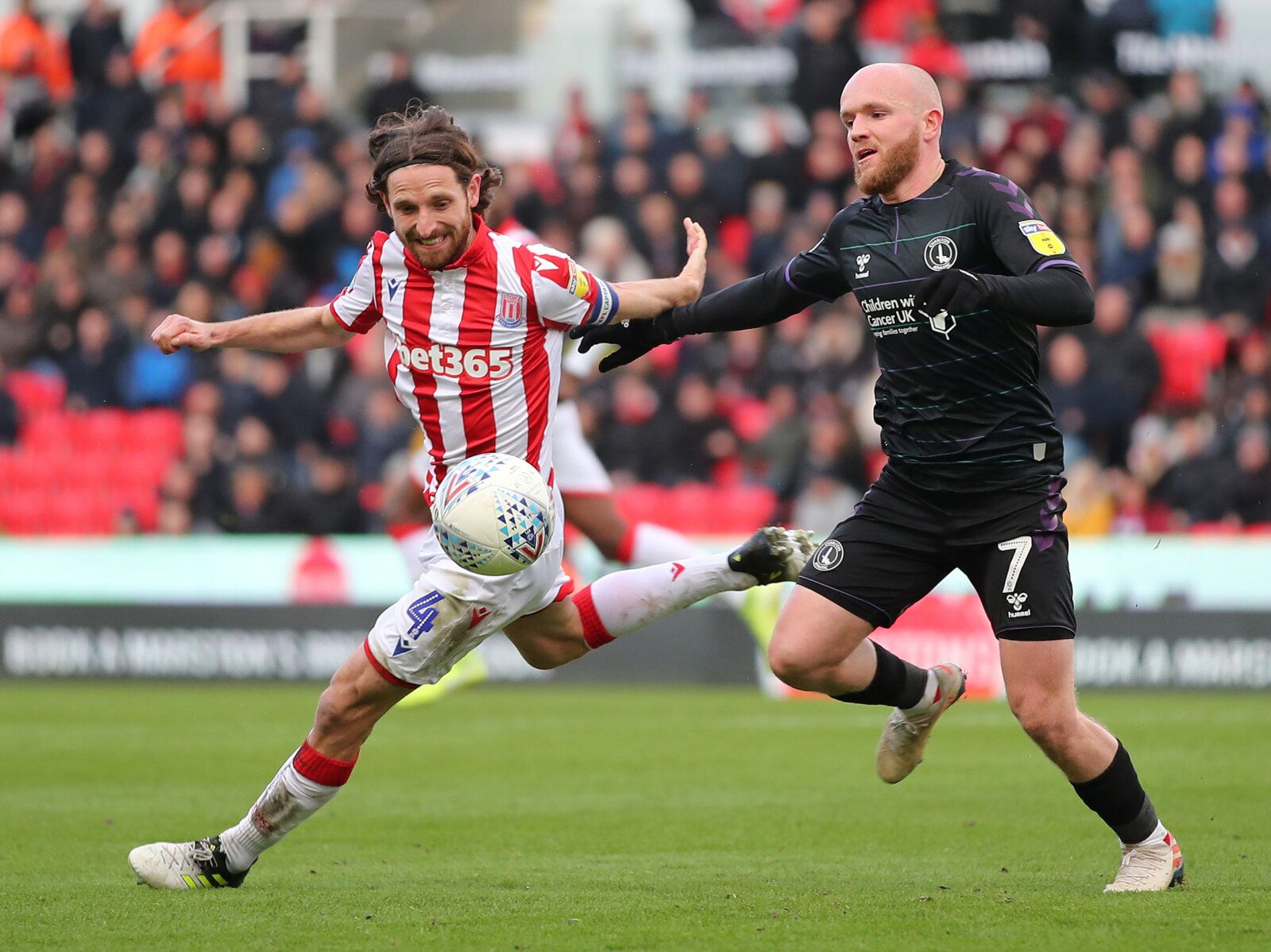 Soccer Football - Championship - Stoke City v Charlton Athletic - bet365 Stadium, Stoke-on-Trent, Britain - February 8, 2020  Stoke City's Joe Allen in action with Charlton Atheletic's Jonathan Williams  Action Images/Molly Darlington  EDITORIAL USE ONLY. No use with unauthorized audio, video, data, fixture lists, club/league logos or 
