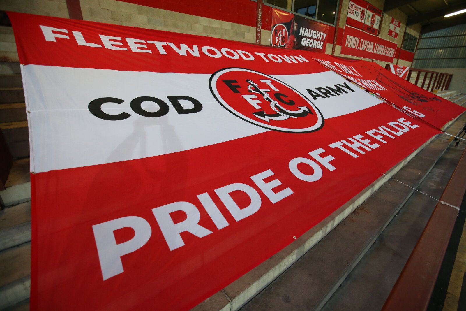 Soccer Football - Carabao Cup Third Round - Fleetwood Town v Everton - Highbury Stadium, Fleetwood, Britain - September 23, 2020 General view of a Fleetwood Town flag displayed in the stand before the match Pool via REUTERS/Alex Livesey EDITORIAL USE ONLY. No use with unauthorized audio, video, data, fixture lists, club/league logos or 'live' services. Online in-match use limited to 75 images, no video emulation. No use in betting, games or single club/league/player publications.  Please contact