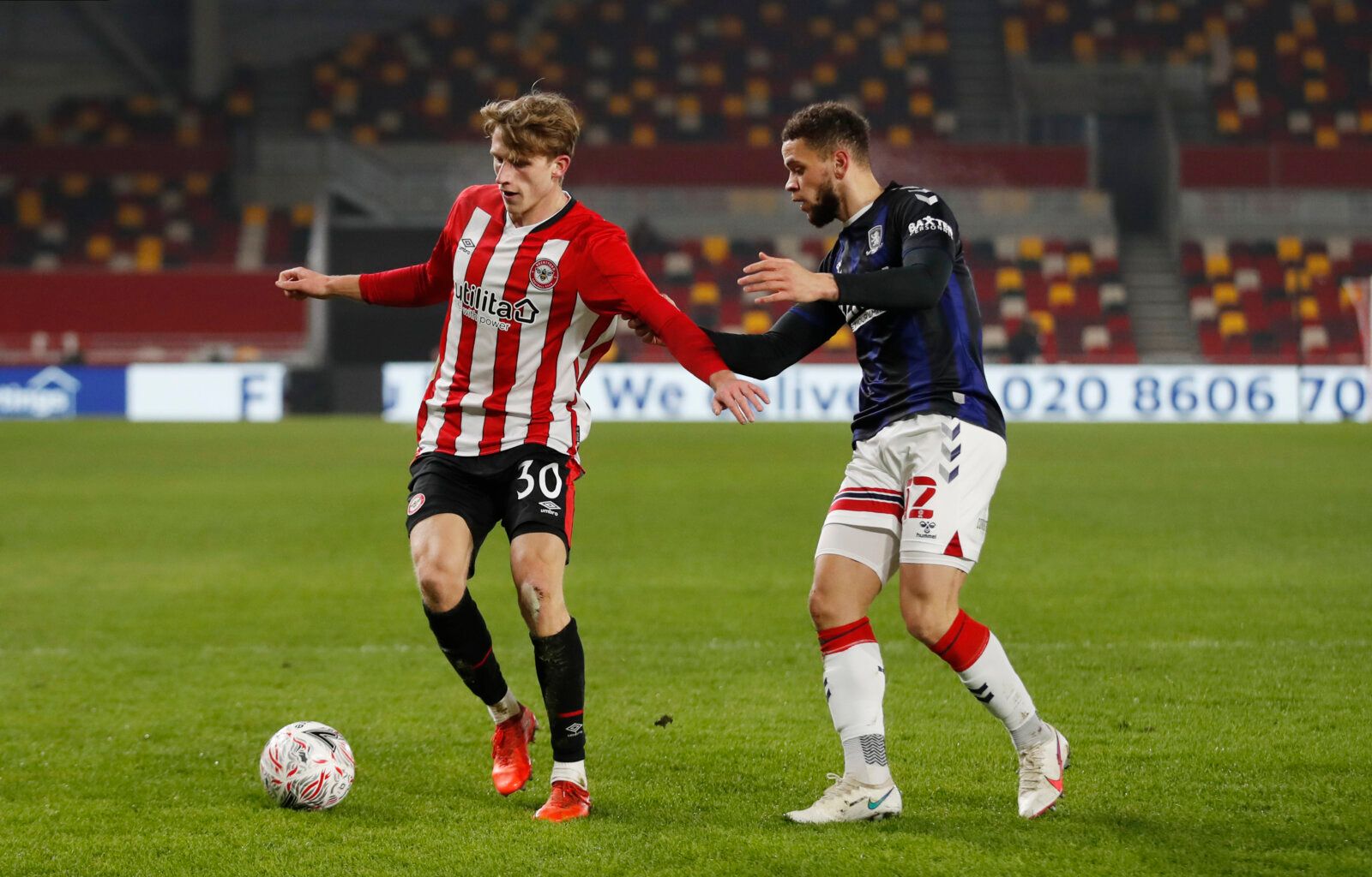 Soccer Football - FA Cup - Third Round - Brentford v Middlesbrough - Brentford Community Stadium, London, Britain - January 9, 2021  Brentford's Mads Roerslev in action with Middlesbrough's Marcus Browne Action Images via Reuters/Matthew Childs