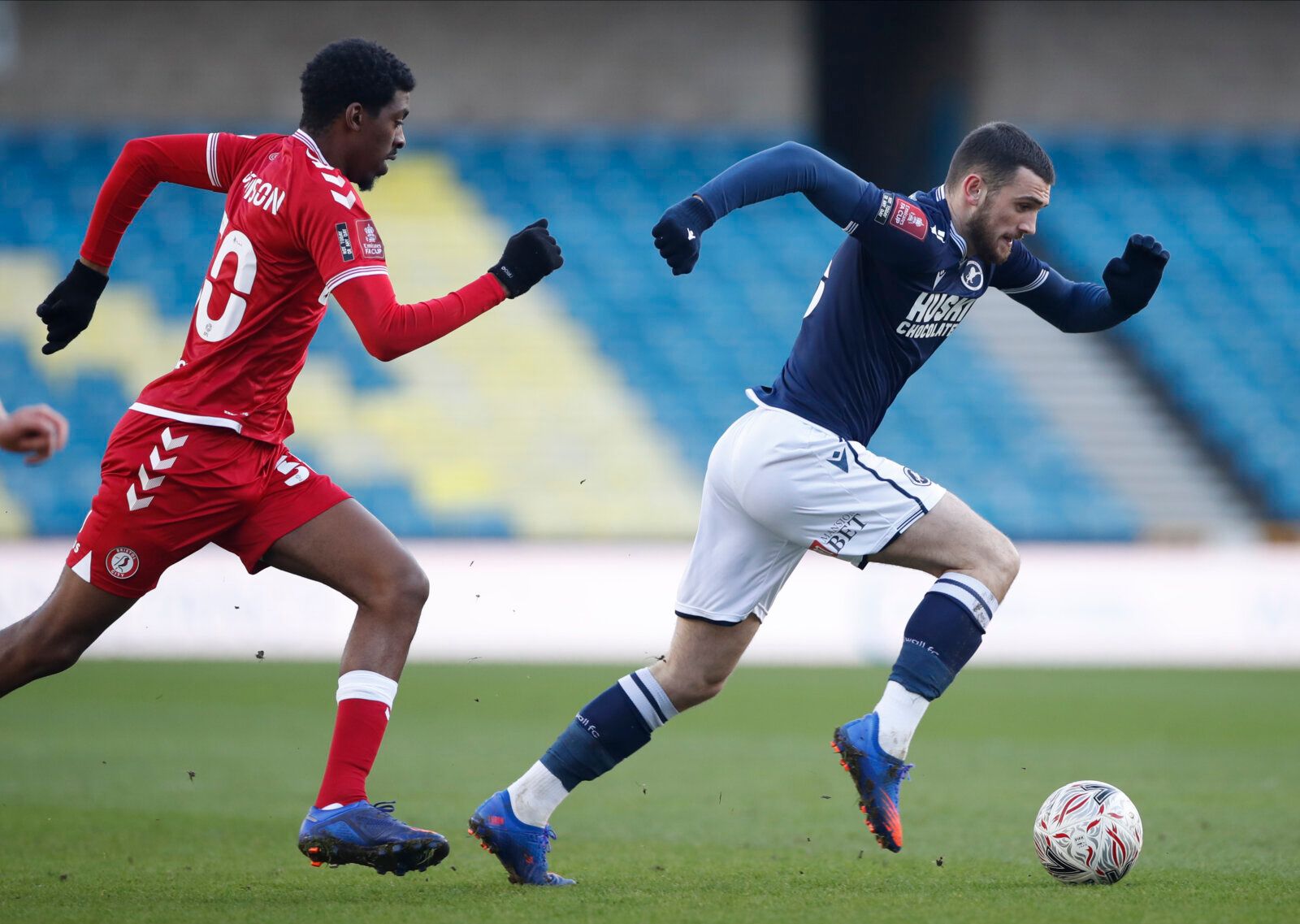 Soccer Football - FA Cup - Fourth Round - Millwall v Bristol City - The Den, London, Britain - January 23, 2021 Millwall's Troy Parrott and Bristol City's Tyreeq Bakinson Action Images/Paul Childs