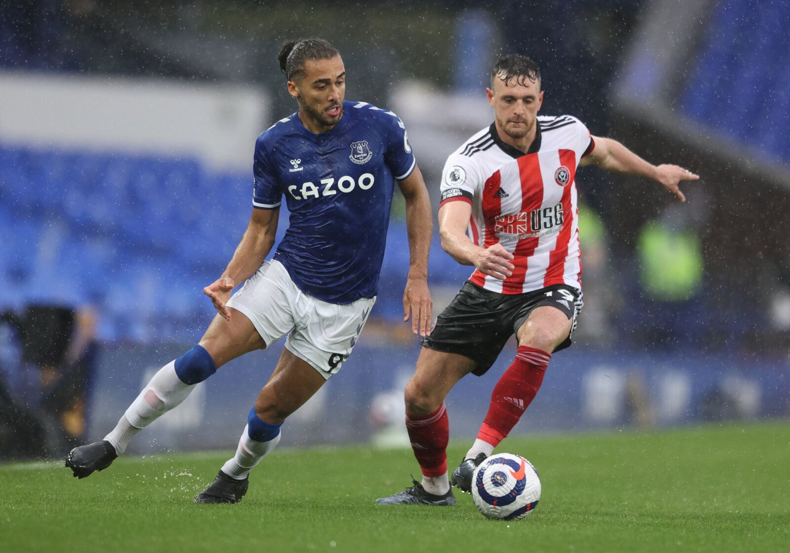 Soccer Football - Premier League - Everton v Sheffield United - Goodison Park, Liverpool, Britain - May 16, 2021 Everton's Dominic Calvert-Lewin in action with Sheffield United's Jack Robinson Pool via REUTERS/Alex Pantling EDITORIAL USE ONLY. No use with unauthorized audio, video, data, fixture lists, club/league logos or 'live' services. Online in-match use limited to 75 images, no video emulation. No use in betting, games or single club /league/player publications.  Please contact your accoun