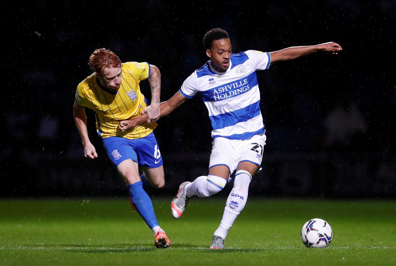 Soccer Football - Championship - Queens Park Rangers v Birmingham City - Loftus Road, London, Britain - September 28, 2021  QPR?s Chris Willock in action with Birmingham City's Ryan Woods  Action Images/Matthew Childs  EDITORIAL USE ONLY. No use with unauthorized audio, video, data, fixture lists, club/league logos or 