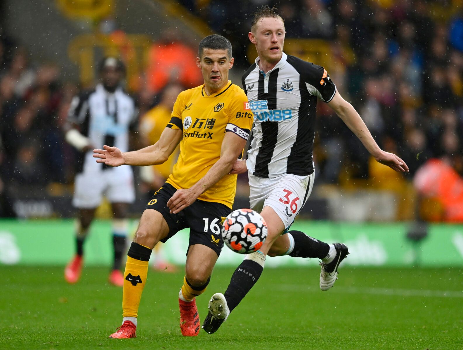 Soccer Football - Premier League - Wolverhampton Wanderers v Newcastle United - Molineux Stadium, Wolverhampton, Britain - October 2, 2021 Wolverhampton Wanderers' Conor Coady in action with Newcastle United's Sean Longstaff REUTERS/Tony Obrien EDITORIAL USE ONLY. No use with unauthorized audio, video, data, fixture lists, club/league logos or 'live' services. Online in-match use limited to 75 images, no video emulation. No use in betting, games or single club /league/player publications.  Pleas