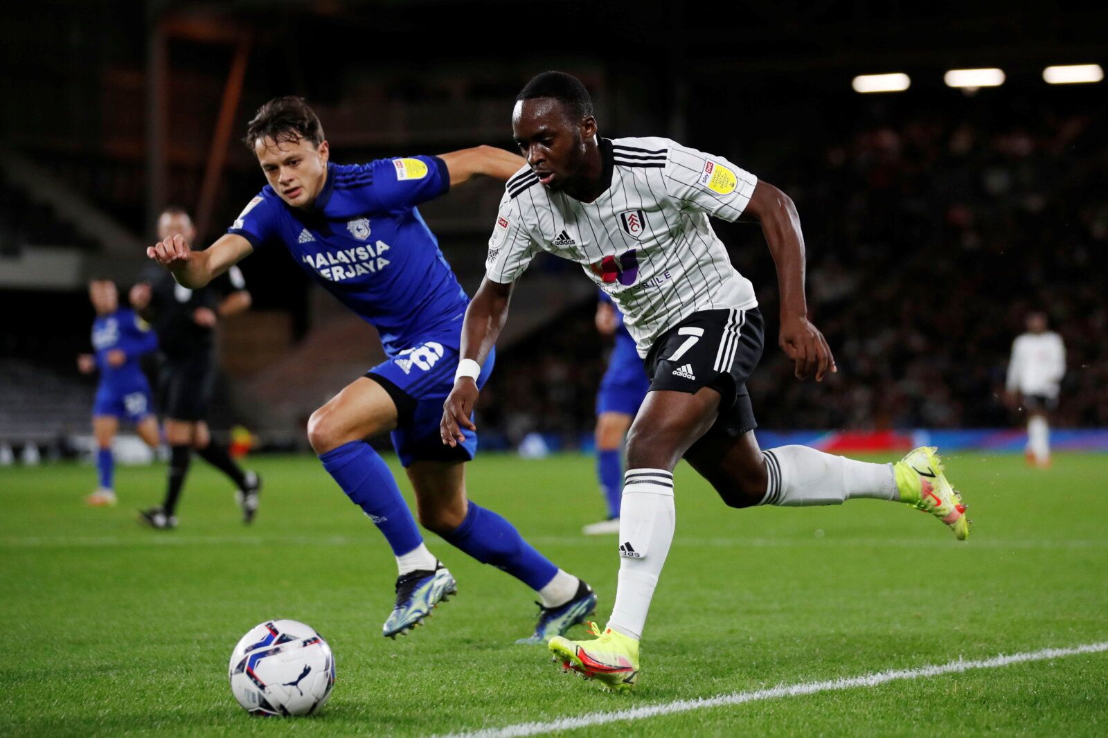 Soccer Football - Championship - Fulham v Cardiff City - Craven Cottage, London, Britain - October 20, 2021 Fulham’s Neeskens Kebano in action with Cardiff City’s Perry Ng   Action Images/Peter Cziborra  EDITORIAL USE ONLY. No use with unauthorized audio, video, data, fixture lists, club/league logos or 