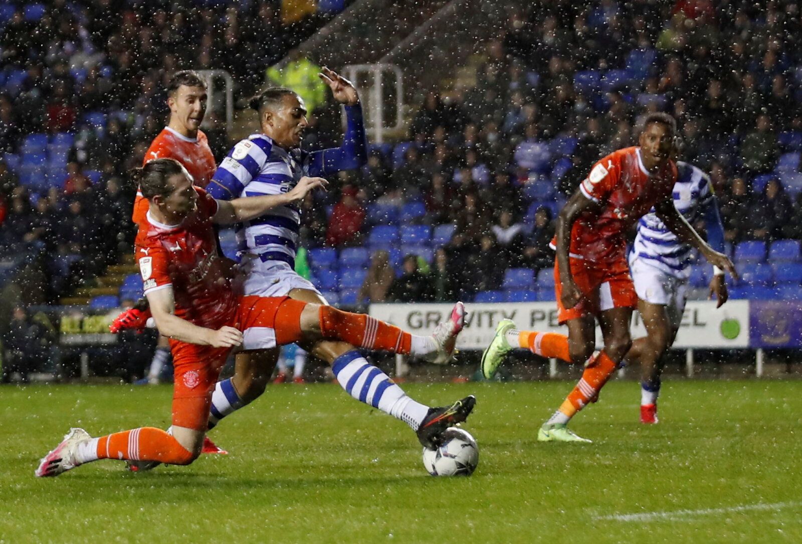 Soccer Football - Championship - Reading v Blackpool - Madejski Stadium, Reading, Britain - October 20, 2021 Blackpool’s James Husband in action with Reading’s Femi Azeez Action Images/Andrew Boyers  EDITORIAL USE ONLY. No use with unauthorized audio, video, data, fixture lists, club/league logos or 