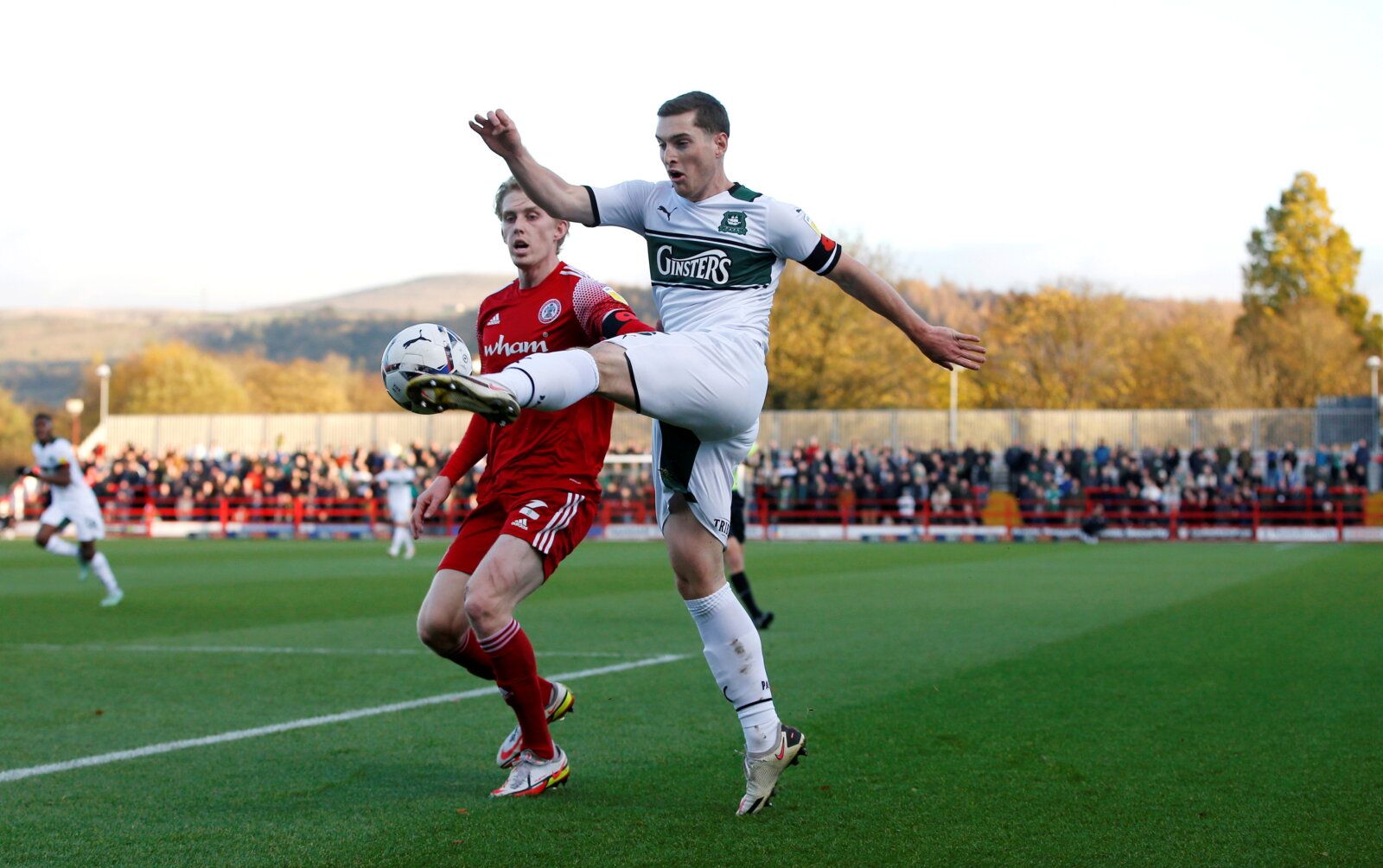 Soccer Football - League One - Accrington Stanley v Plymouth Argyle - Wham Stadium, Accrington, Britain - November 13, 2021 Plymouth Argyle's Conor Grant in action with Accrington Stanley's Harvey Rodgers Action Images/Ed Sykes