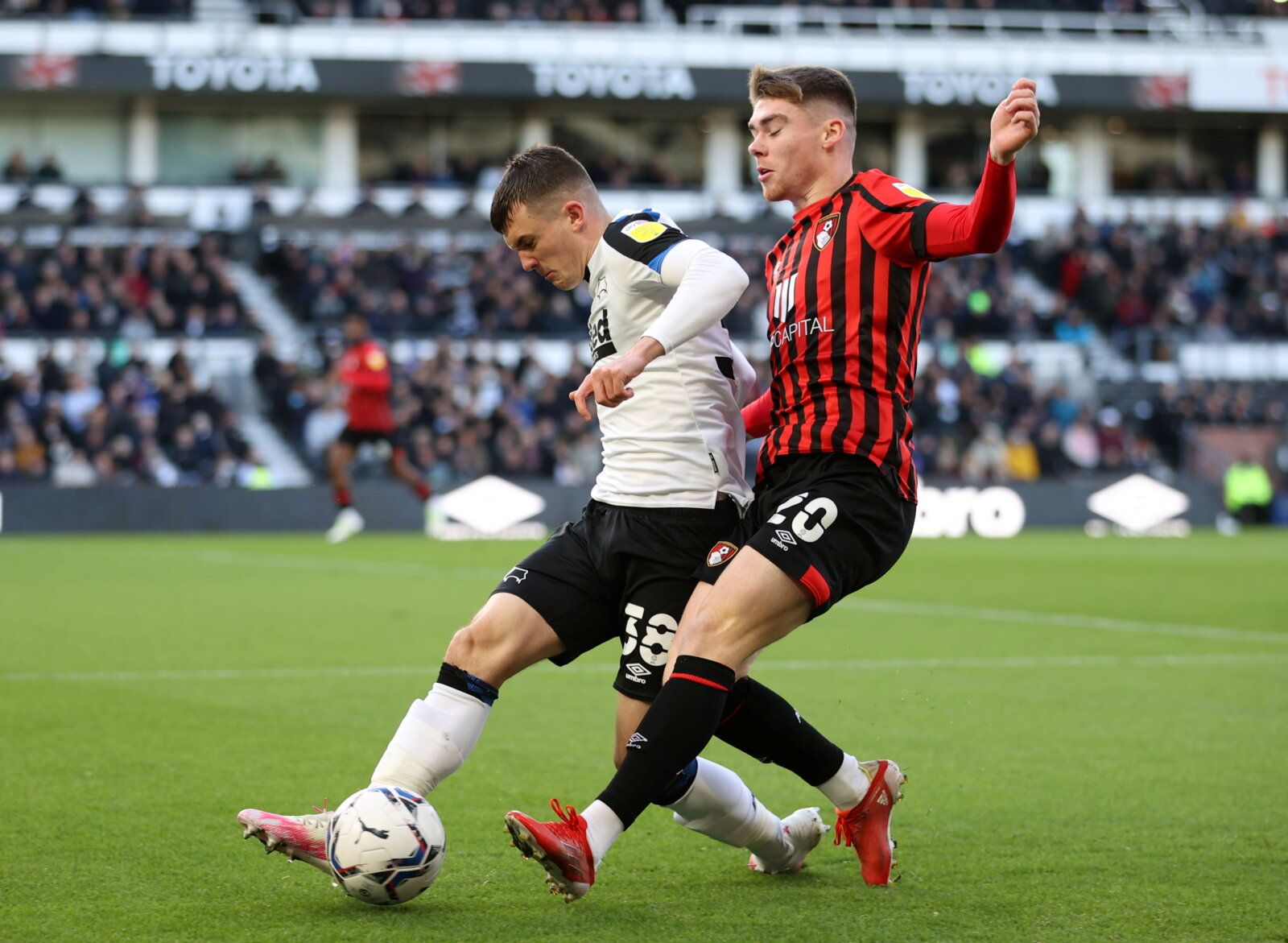 Soccer Football - Championship - Derby County v AFC Bournemouth - Pride Park, Derby, Britain - November 21, 2021 Derby County's Jason Knight in action with Bournemouth's Leif Davis  Molly Darlington/Action Images