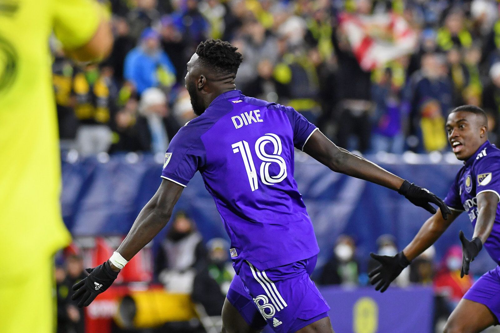 Nov 23, 2021; Nashville, TN, USA; Orlando City forward Daryl Dike (18) celebrates after scoring a goal against Nashville SC during the first half of a round one MLS Playoff game at Nissan Stadium. Mandatory Credit: Christopher Hanewinckel-USA TODAY Sports