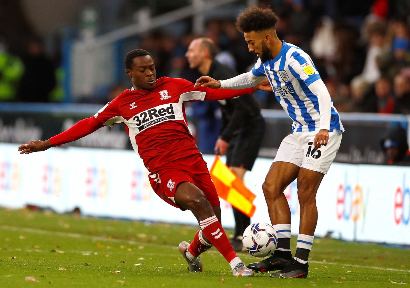 Soccer Football - Championship - Huddersfield Town v Middlesbrough - John Smith's Stadium, Huddersfield, Britain - November 27, 2021 Middlesbrough's Marc Bola in action with Huddersfield Town's Sorba Thomas   Action Images/Jason Cairnduff