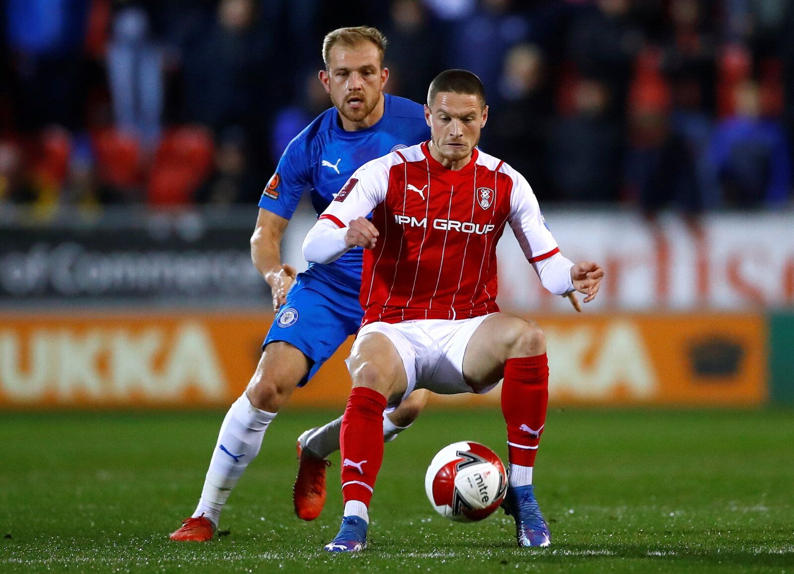 Soccer Football - FA Cup Second Round - Rotherham United v Stockport County - AESSEAL New York Stadium, Rotherham, Britain - December 3, 2021 Rotherham United's Ben Wiles in action with Stockport County's Ryan Croasdale Action Images/Jason Cairnduff