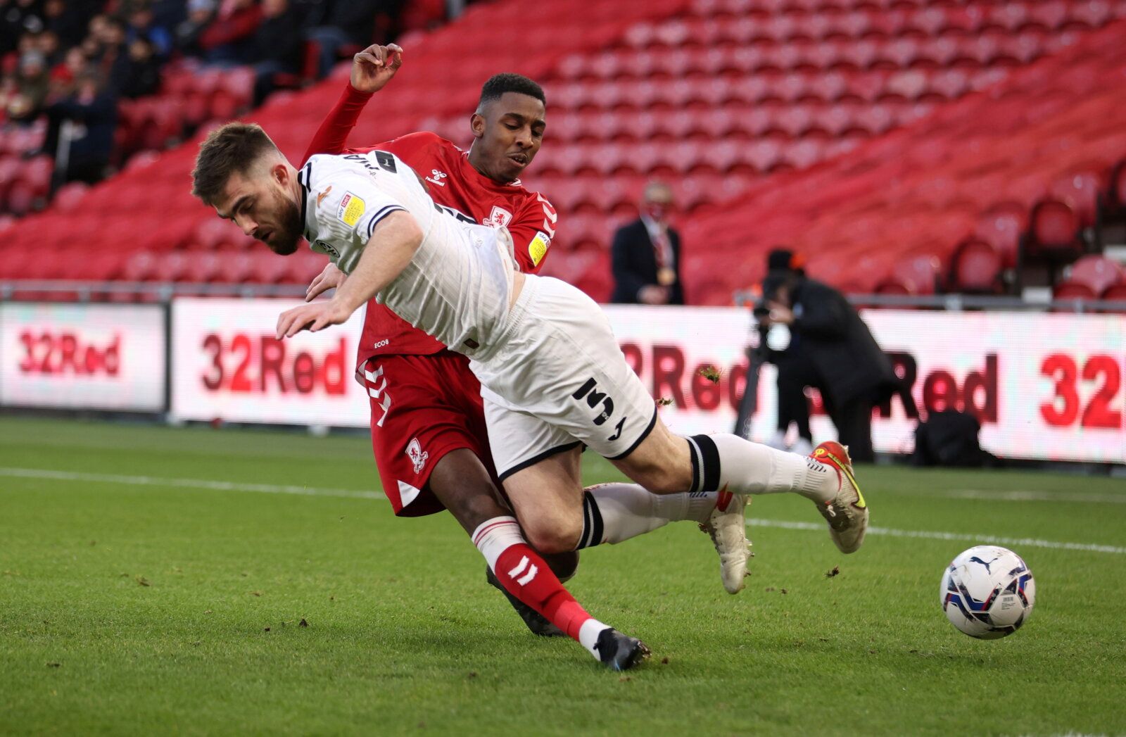Soccer Football - Middlesbrough v Swansea City - Riverside Stadium, Middlesbrough, Britain - December 4, 2021  Swansea City's Ryan Manning in action with Middlesbrough's Isaiah Jones  Action Images/John Clifton  EDITORIAL USE ONLY. No use with unauthorized audio, video, data, fixture lists, club/league logos or 