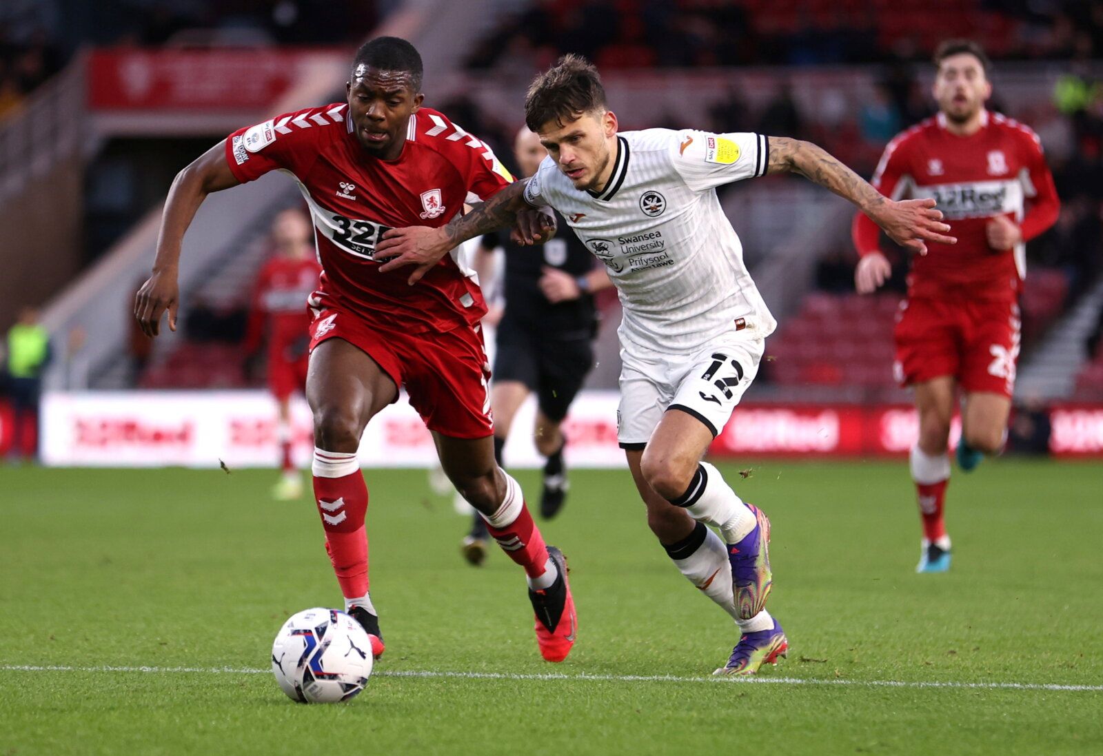 Soccer Football - Middlesbrough v Swansea City - Riverside Stadium, Middlesbrough, Britain - December 4, 2021  Swansea City's Jamie Paterson in action with Middlesbrough's Anfernee Dijksteel  Action Images/John Clifton  EDITORIAL USE ONLY. No use with unauthorized audio, video, data, fixture lists, club/league logos or 