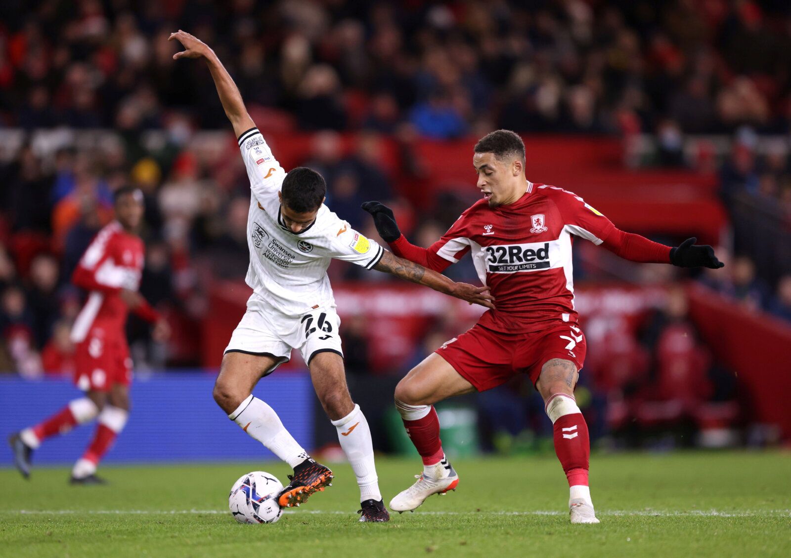 Soccer Football - Middlesbrough v Swansea City - Riverside Stadium, Middlesbrough, Britain - December 4, 2021  Swansea City's Kyle Naughton in action with Middlesbrough's Marcus Tavernier  Action Images/John Clifton  EDITORIAL USE ONLY. No use with unauthorized audio, video, data, fixture lists, club/league logos or 