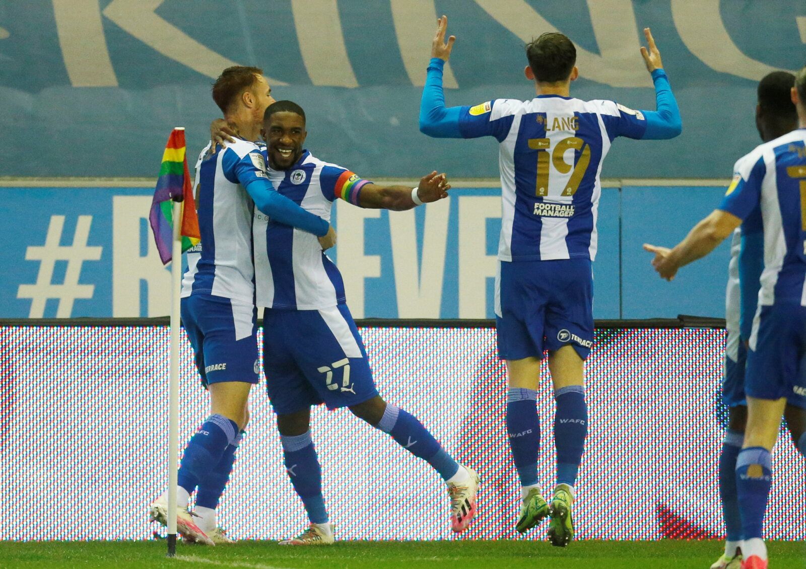 Soccer Football - League One - Wigan Athletic v Shrewsbury Town - DW Stadium, Wigan, Britain - December 8, 2021  Wigan Athletic's Tendayi Darikwa celebrates scoring their first goal with teammates    Action Images/Ed Sykes  EDITORIAL USE ONLY. No use with unauthorized audio, video, data, fixture lists, club/league logos or 