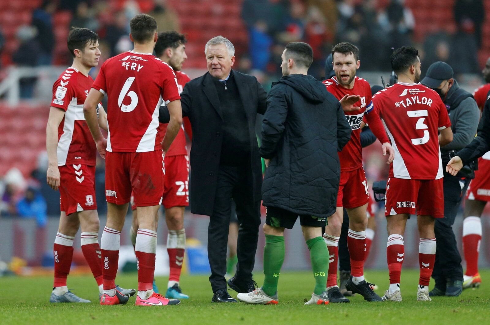 Soccer Football - Championship - Middlesbrough v AFC Bournemouth - Riverside Stadium, Middlesbrough, Britain - December 18, 2021 Middlesbrough manager Chris Wilder celebrates with his players after the match  Action Images/Ed Sykes  EDITORIAL USE ONLY. No use with unauthorized audio, video, data, fixture lists, club/league logos or 