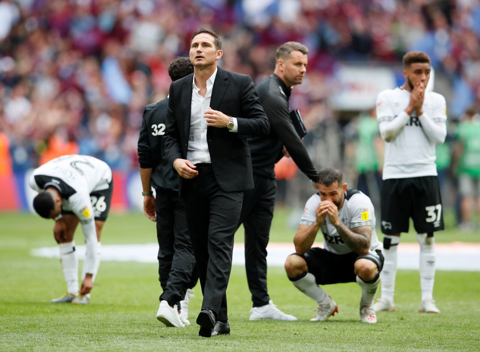 Soccer Football - Championship Playoff Final - Aston Villa v Derby County - Wembley Stadium, London, Britain - May 27, 2019  Derby County manager Frank Lampard, Jayden Bogle and teammates look dejected at the end of the match   REUTERS/David Klein