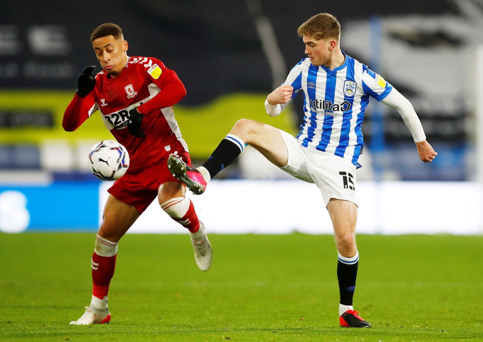 Soccer Football - Championship - Huddersfield Town v Middlesbrough - John Smith's Stadium, Huddersfield, Britain - November 27, 2021 Middlesbrough's Marcus Tavernier in action with Huddersfield Town's Scott High   Action Images/Jason Cairnduff