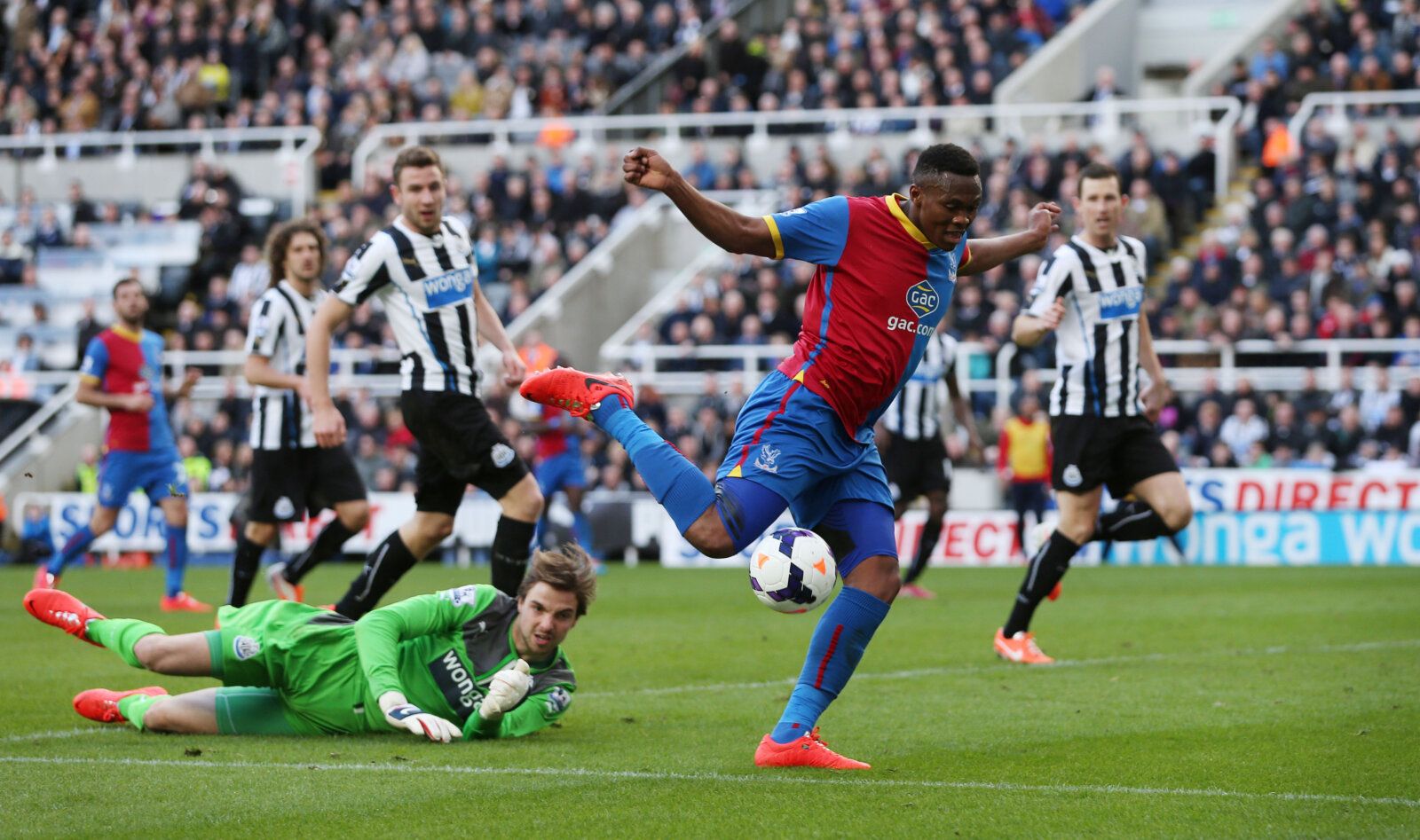 Football - Newcastle United v Crystal Palace - Barclays Premier League - St James' Park - 22/3/14 
Newcastle's Tim Krul saves from Crystal Palace's  
Kagisho Dikgacoi 
Mandatory Credit: Action Images / Lee Smith 
Livepic 
EDITORIAL USE ONLY. No use with unauthorized audio, video, data, fixture lists, club/league logos or 