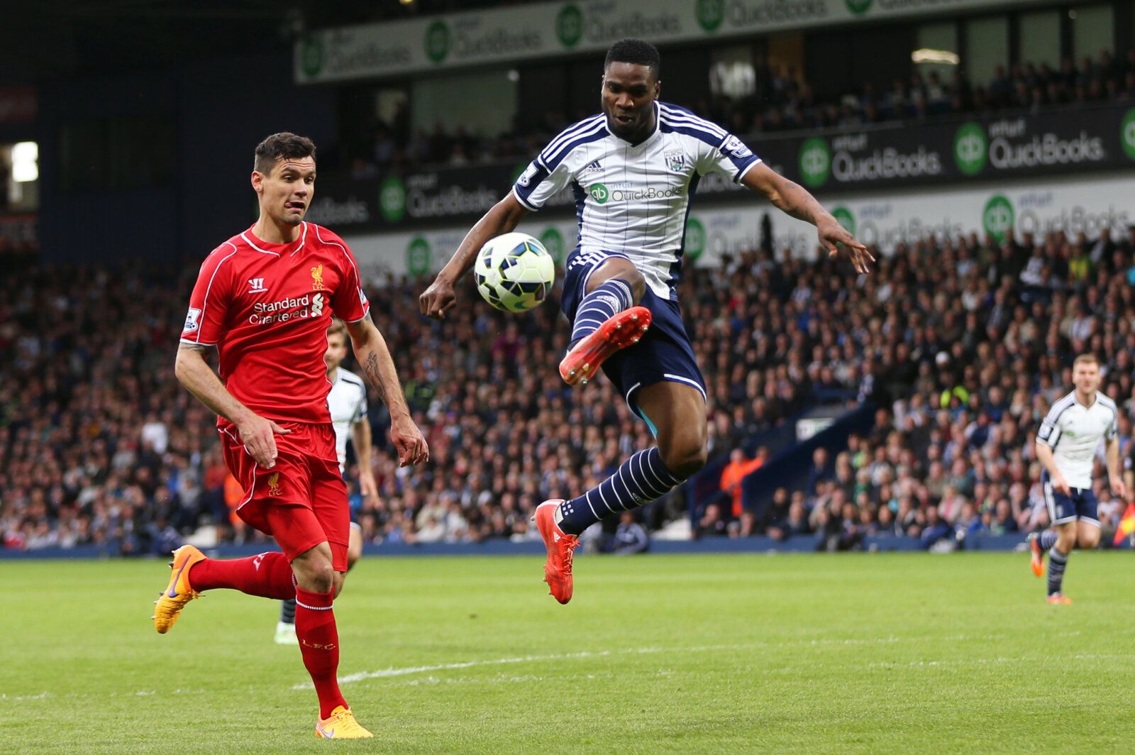 Football - West Bromwich Albion v Liverpool - Barclays Premier League - The Hawthorns - 25/4/15 
Liverpool's Dejan Lovren in action with West Brom's Brown Ideye 
Action Images via Reuters / Alex Morton 
Livepic 
EDITORIAL USE ONLY. No use with unauthorized audio, video, data, fixture lists, club/league logos or 