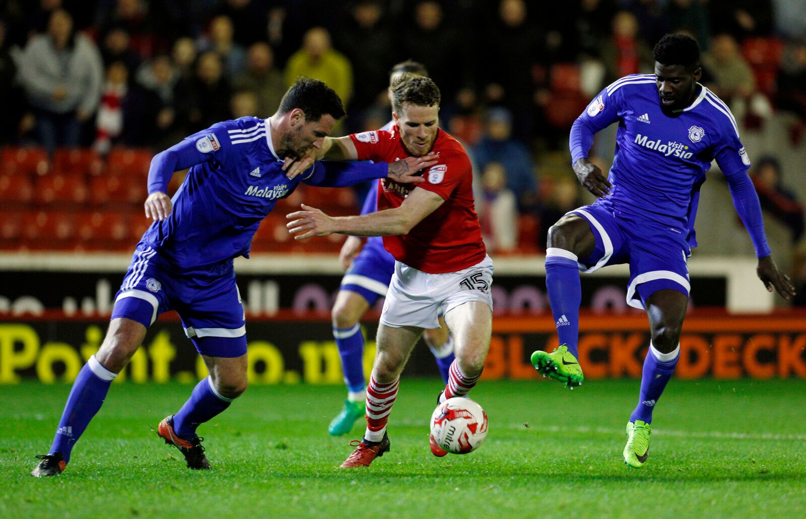 Britain Football Soccer - Barnsley v Cardiff City - Sky Bet Championship - Oakwell - 4/4/17 Cardiff City's Sean Morrison (L) and Bruno Ecuele Manga (R) in action with Barnsley's Marley Watkins Mandatory Credit: Action Images / Craig Brough Livepic EDITORIAL USE ONLY. No use with unauthorized audio, video, data, fixture lists, club/league logos or 