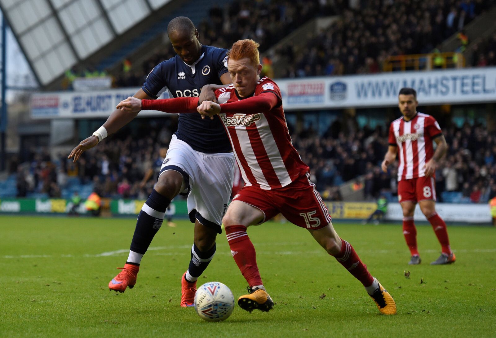 Soccer Football - Championship - Millwall vs Brentford - The Den, London, Britain - March 10, 2018  Brentford's Ryan Woods in action with Millwall's Tom Elliott  Action Images/Adam Holt  EDITORIAL USE ONLY. No use with unauthorized audio, video, data, fixture lists, club/league logos or 