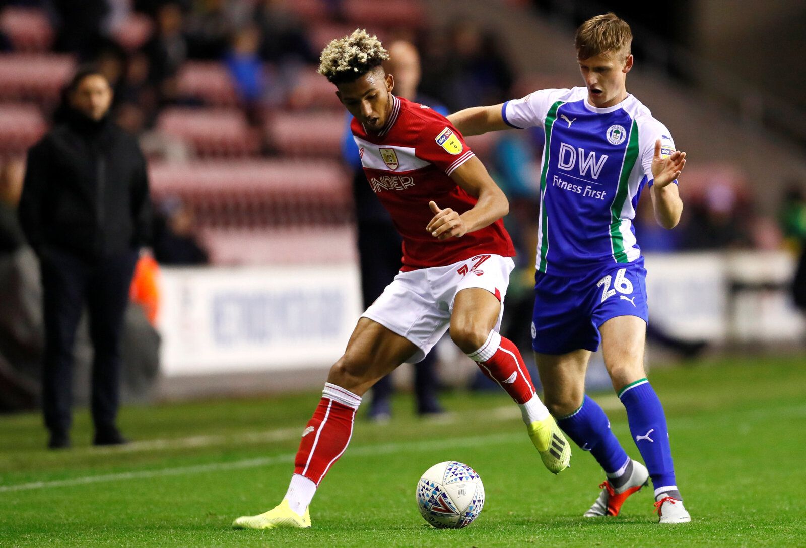 Soccer Football - Championship - Wigan Athletic v Bristol City - DW Stadium, Wigan, Britain - September 21, 2018   Bristol City's Lloyd Kelly in action with Wigan Athletic's Callum Connolly   Action Images/Jason Cairnduff    EDITORIAL USE ONLY. No use with unauthorized audio, video, data, fixture lists, club/league logos or 