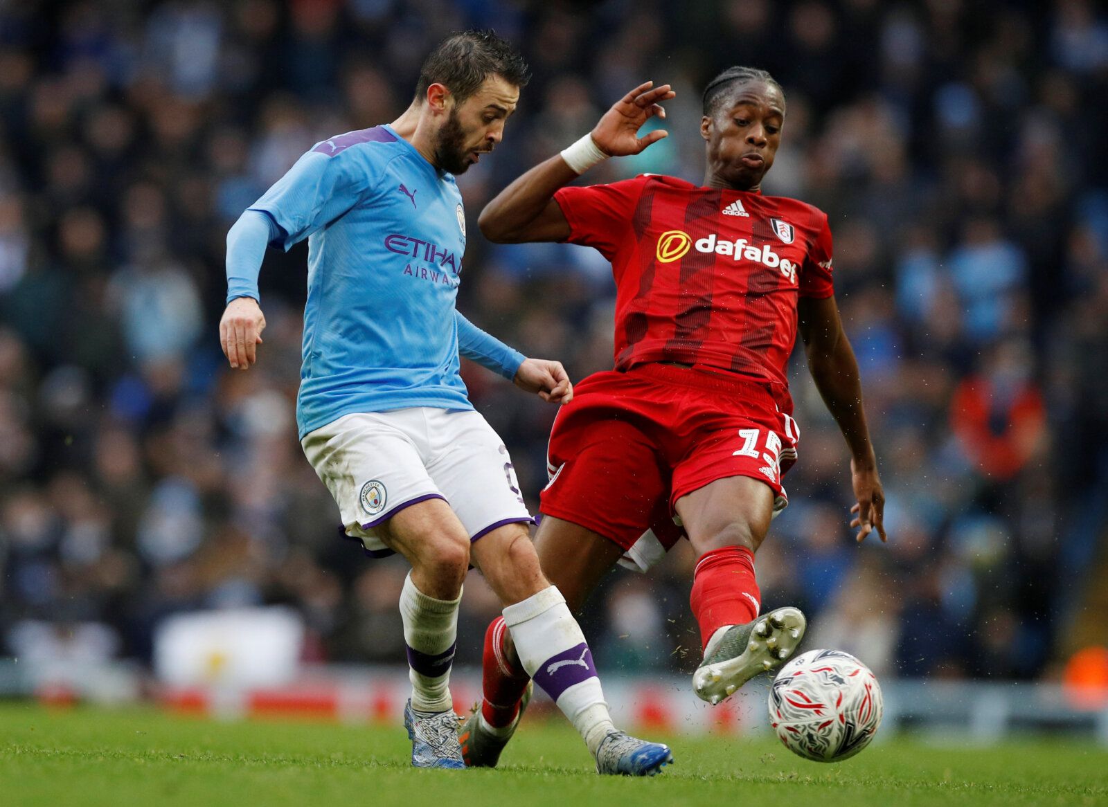 Soccer Football - FA Cup Fourth Round - Manchester City v Fulham - Etihad Stadium, Manchester, Britain - January 26, 2020  Manchester City's Bernardo Silva in action with Fulham's Terence Kongolo  REUTERS/Phil Noble