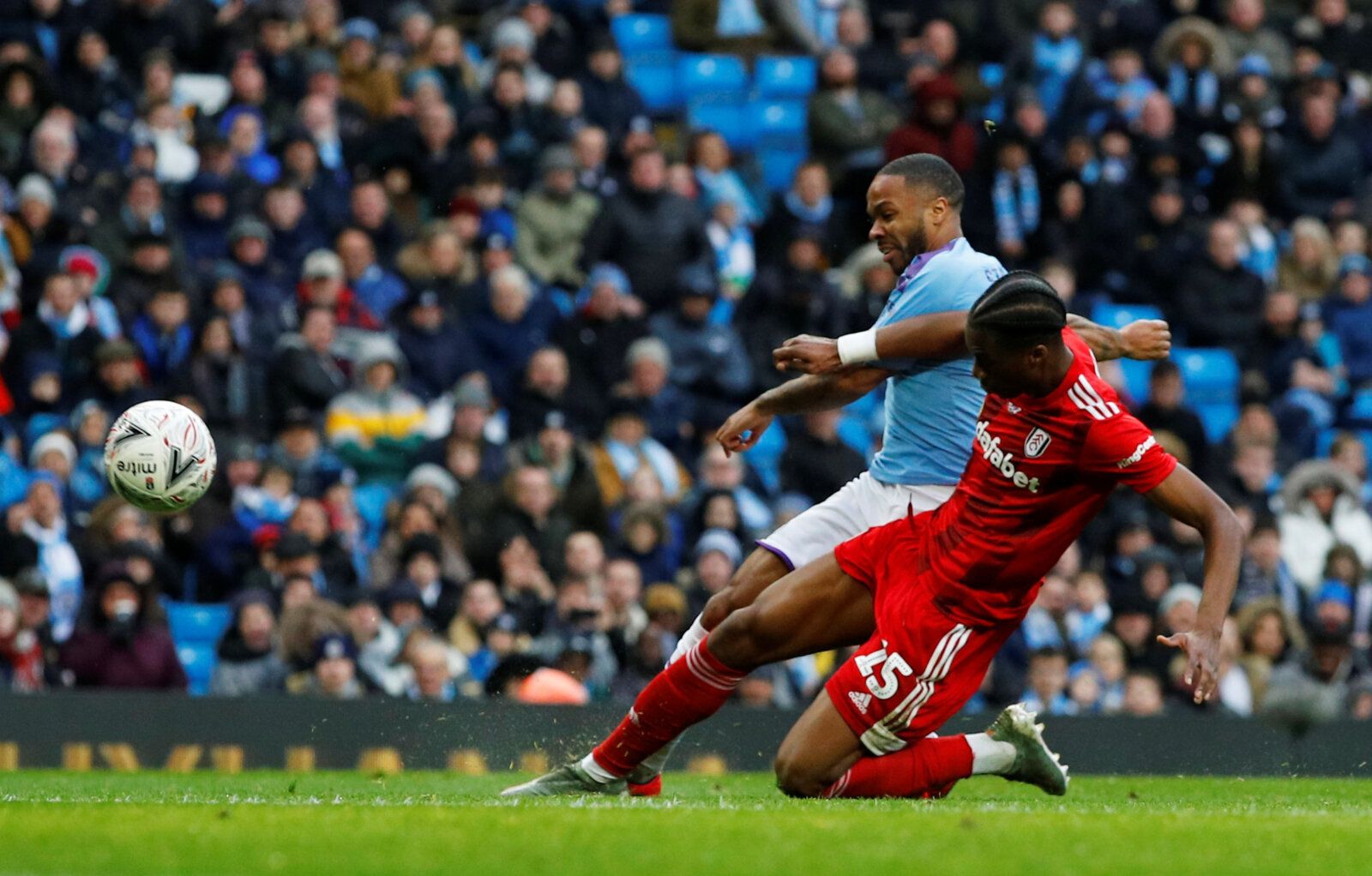 Soccer Football - FA Cup Fourth Round - Manchester City v Fulham - Etihad Stadium, Manchester, Britain - January 26, 2020  Manchester City's Raheem Sterling in action with Fulham's Terence Kongolo  REUTERS/Phil Noble