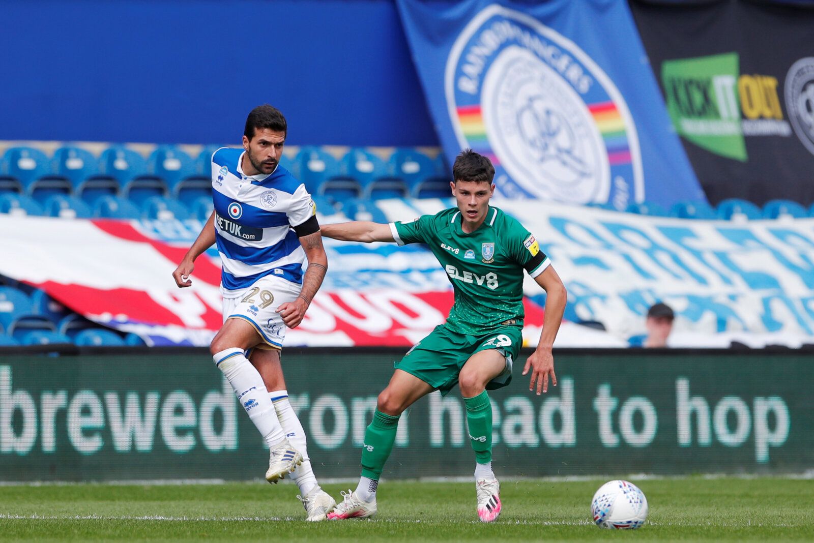 Soccer Football - Championship - Queens Park Rangers v Sheffield Wednesday - Loftus Park, London, Britain - July 11, 2020   Queens Park Rangers' Yoann Barbet in action with Sheffield Wednesday's Alex Hunt, as play resumes behind closed doors following the outbreak of the coronavirus disease (COVID-19)   Action Images/Andrew Couldridge    EDITORIAL USE ONLY. No use with unauthorized audio, video, data, fixture lists, club/league logos or 