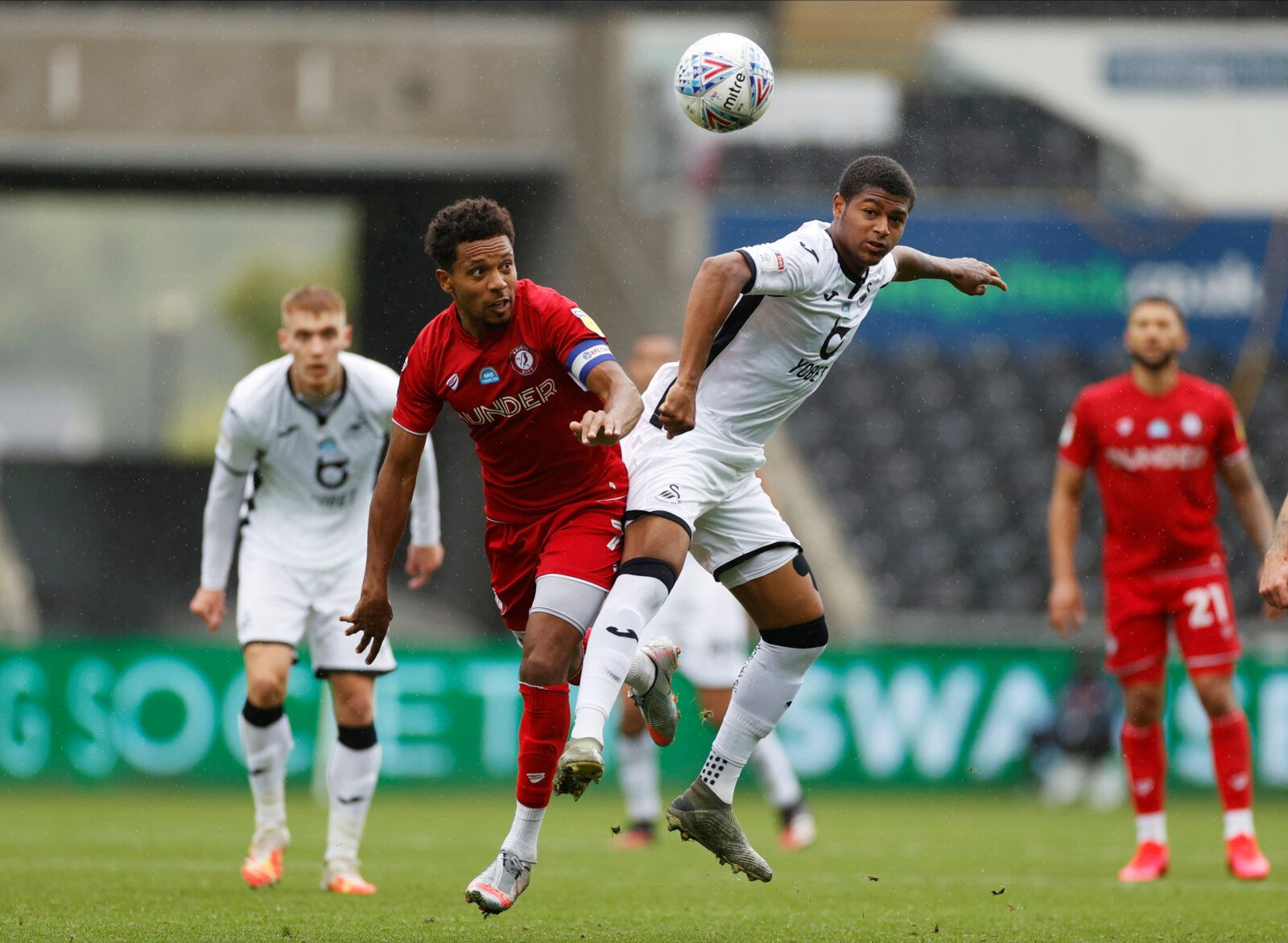 Soccer Football - Championship - Swansea City v Bristol City - Liberty Stadium, Swansea, Britain - July 18, 2020  Bristol City's Korey Smith in action with Swansea City's Rhian Brewster, as play resumes behind closed doors following the outbreak of the coronavirus disease (COVID-19)  Action Images/John Sibley  EDITORIAL USE ONLY. No use with unauthorized audio, video, data, fixture lists, club/league logos or 