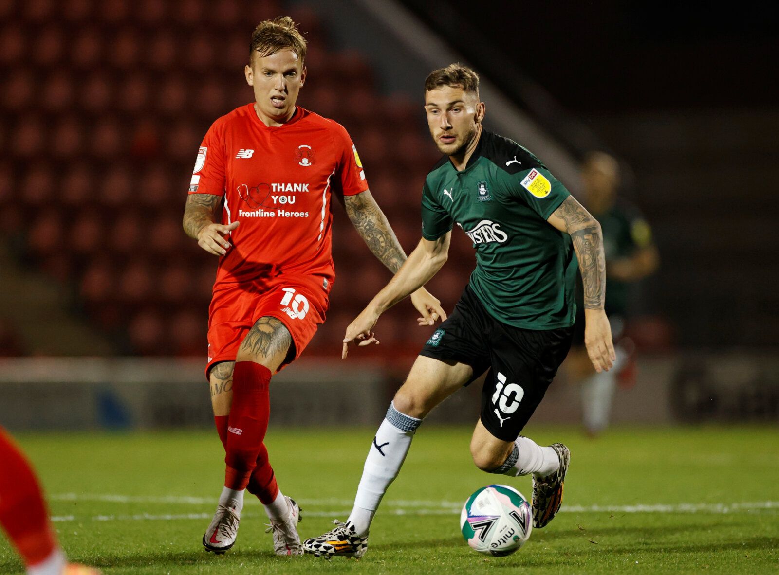 Soccer Football - Carabao Cup Second Round - Leyton Orient v Plymouth Argyle - Matchroom Stadium, London, Britain - September 15, 2020  Plymouth Argyle's Danny Mayor in action with Leyton Orient's Jordan Maguire-Drew  Action Images/John Sibley  EDITORIAL USE ONLY. No use with unauthorized audio, video, data, fixture lists, club/league logos or 