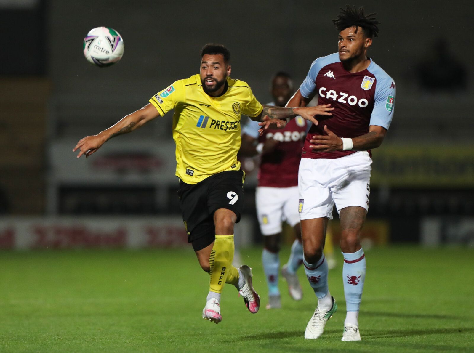 Soccer Football - Carabao Cup Second Round - Burton Albion v Aston Villa - Pirelli Stadium, Burton-on-Trent, Britain - September 15, 2020 Burton Albion's Kane Hemmings in action with Aston Villa's Tyrone Mings Pool via REUTERS/Mike Egerton EDITORIAL USE ONLY. No use with unauthorized audio, video, data, fixture lists, club/league logos or 'live' services. Online in-match use limited to 75 images, no video emulation. No use in betting, games or single club/league/player publications.  Please cont