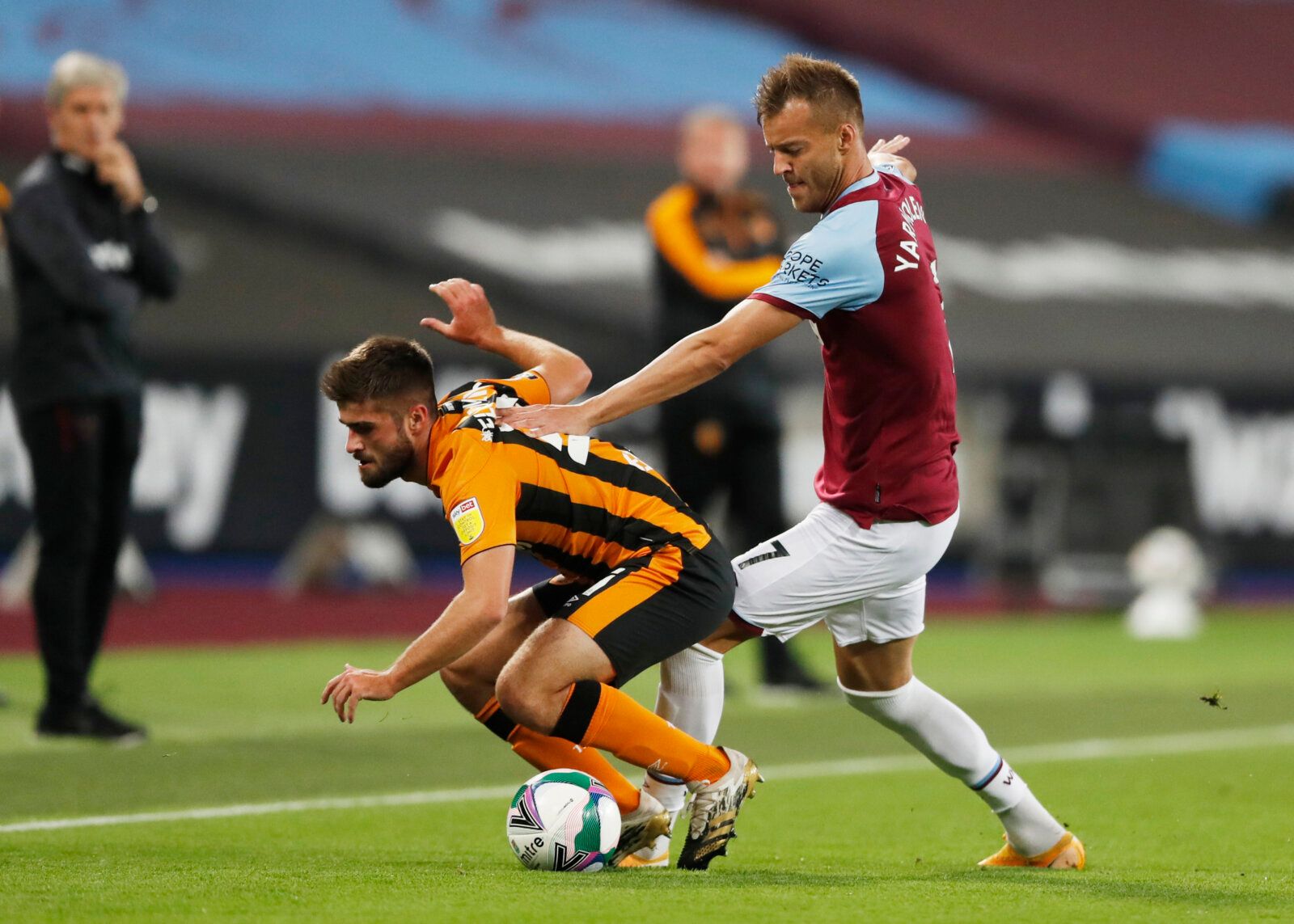 Soccer Football - Carabao Cup Third Round - West Ham United v Hull City - London Stadium, London, Britain - September 22, 2020.  Hull City's Brandon Fleming in action with West Ham United's Andriy Yarmolenko. Pool via REUTERS/Alastair Grant EDITORIAL USE ONLY. No use with unauthorized audio, video, data, fixture lists, club/league logos or 'live' services. Online in-match use limited to 75 images, no video emulation. No use in betting, games or single club/league/player publications.  Please con