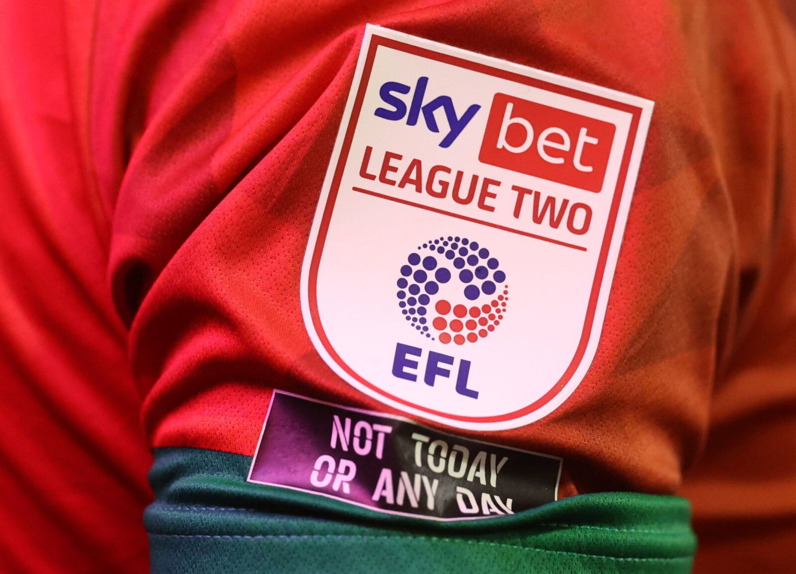 Soccer Football - League Two - Walsall v Leyton Orient - The Banks's Stadium, Walsall, Britain - October 13, 2020   A League Two badge and a against racism badge is seen on a Walsall shirt   Action Images/Carl Recine    EDITORIAL USE ONLY. No use with unauthorized audio, video, data, fixture lists, club/league logos or 
