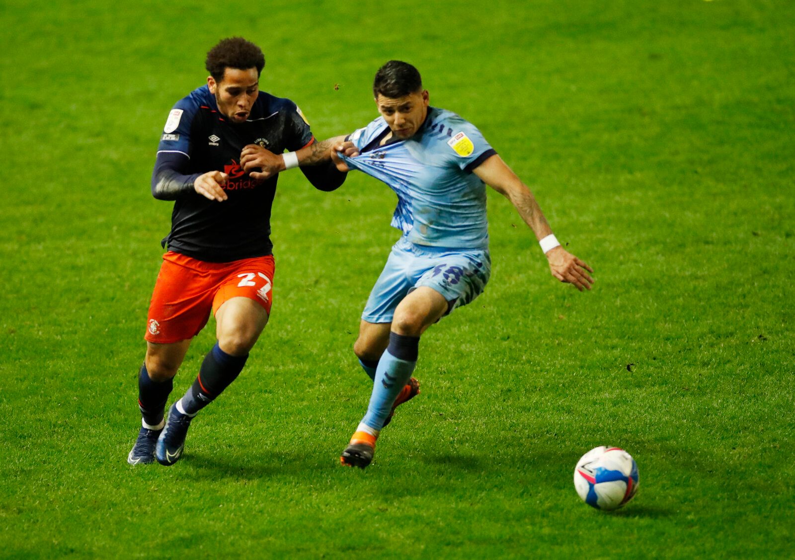 Soccer Football - Championship - Coventry City v Luton Town - St Andrew's, Birmingham, Britain - December 8, 2020 Luton Town's Sam Nombe in action with Coventry City's Gustavo Hamer Action Images/Andrew Boyers EDITORIAL USE ONLY. No use with unauthorized audio, video, data, fixture lists, club/league logos or 'live' services. Online in-match use limited to 75 images, no video emulation. No use in betting, games or single club /league/player publications.  Please contact your account representati