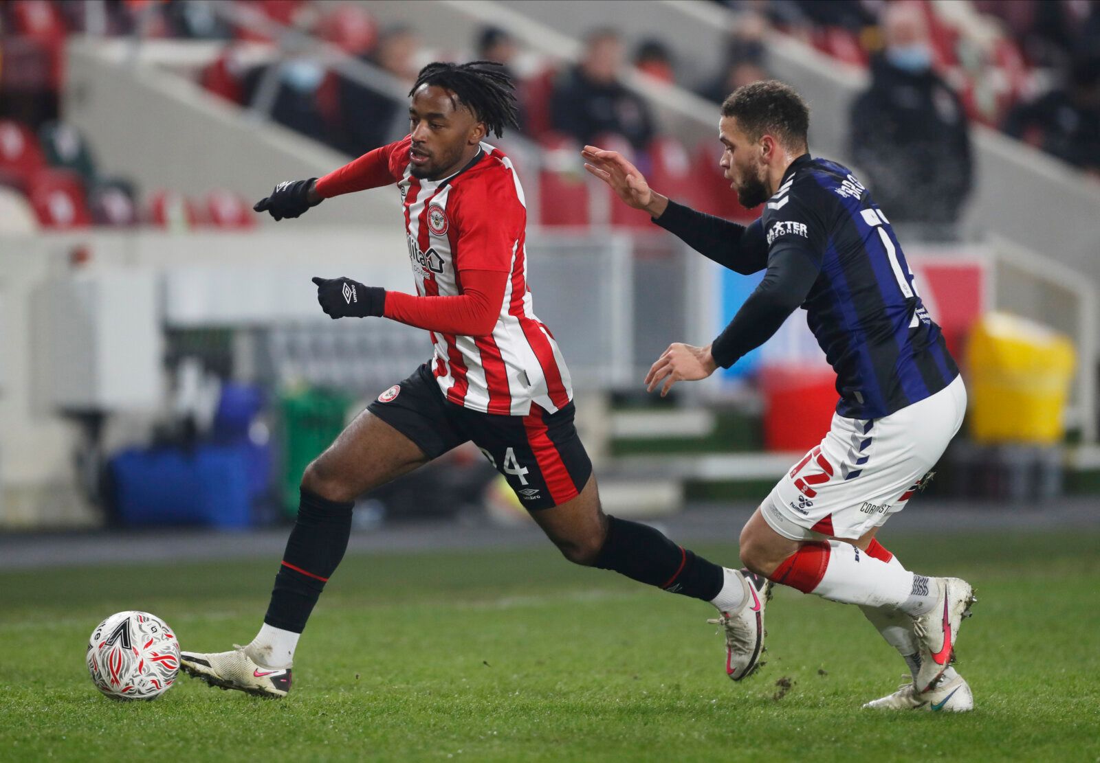 Soccer Football - FA Cup - Third Round - Brentford v Middlesbrough - Brentford Community Stadium, London, Britain - January 9, 2021  Brentford's Tariqe Fosu in action with Middlesbrough's Marcus Browne Action Images via Reuters/Matthew Childs