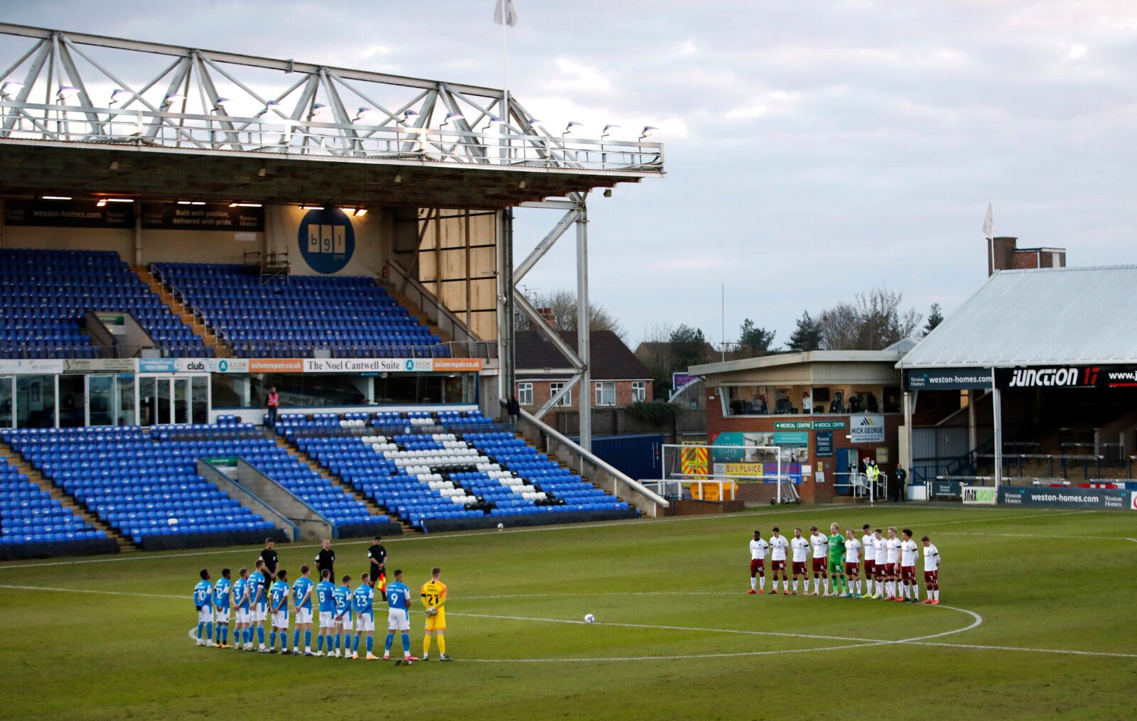 Soccer Football - League One - Peterborough United v Northampton Town - Weston Homes Stadium, Peterborough, Britain - April 16, 2021 General view of players during a two minute silence after Britain's Prince Philip, husband of Queen Elizabeth, died at the age of 99 Action Images via Reuters/Andrew Boyers EDITORIAL USE ONLY. No use with unauthorized audio, video, data, fixture lists, club/league logos or 'live' services. Online in-match use limited to 75 images, no video emulation. No use in bett
