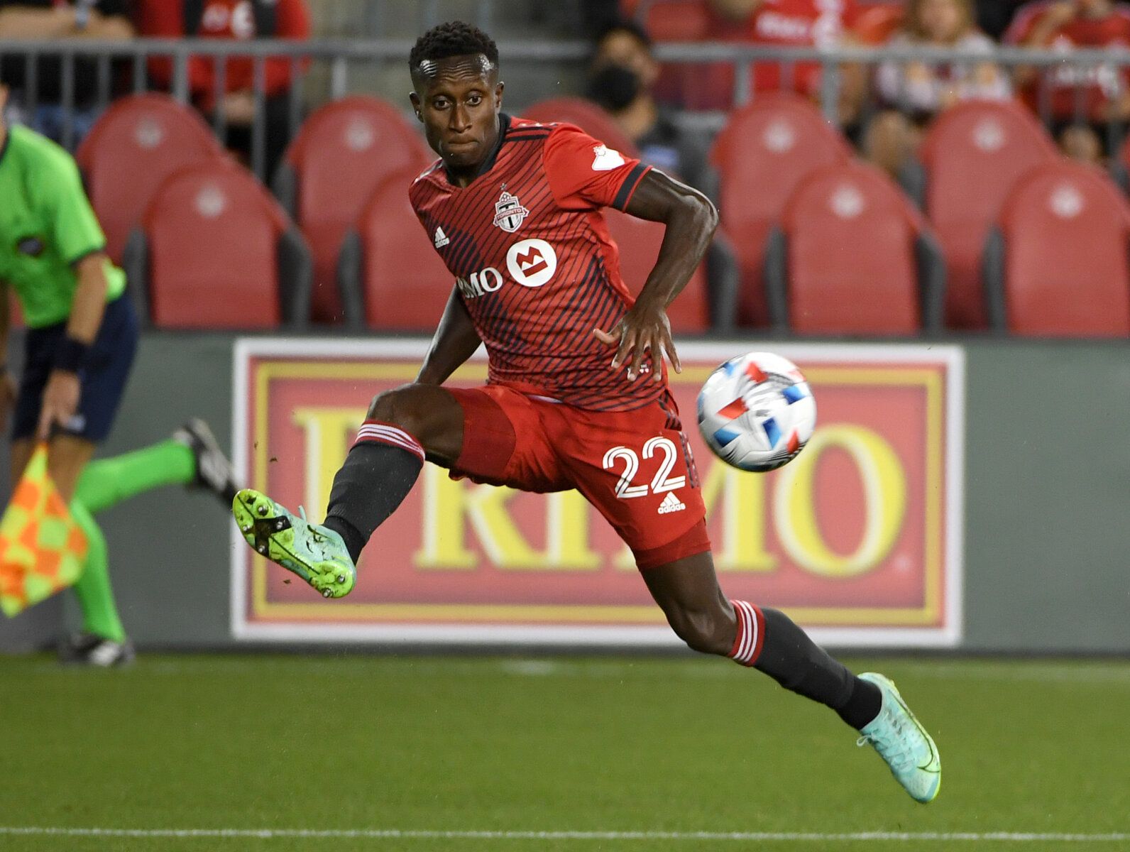 Aug 14, 2021; Toronto, Ontario, CAN;  Toronto FC defender Richie Laryea (22) passes the ball against the New England Revolution in the second half at BMO Field. Mandatory Credit: Dan Hamilton-USA TODAY Sports