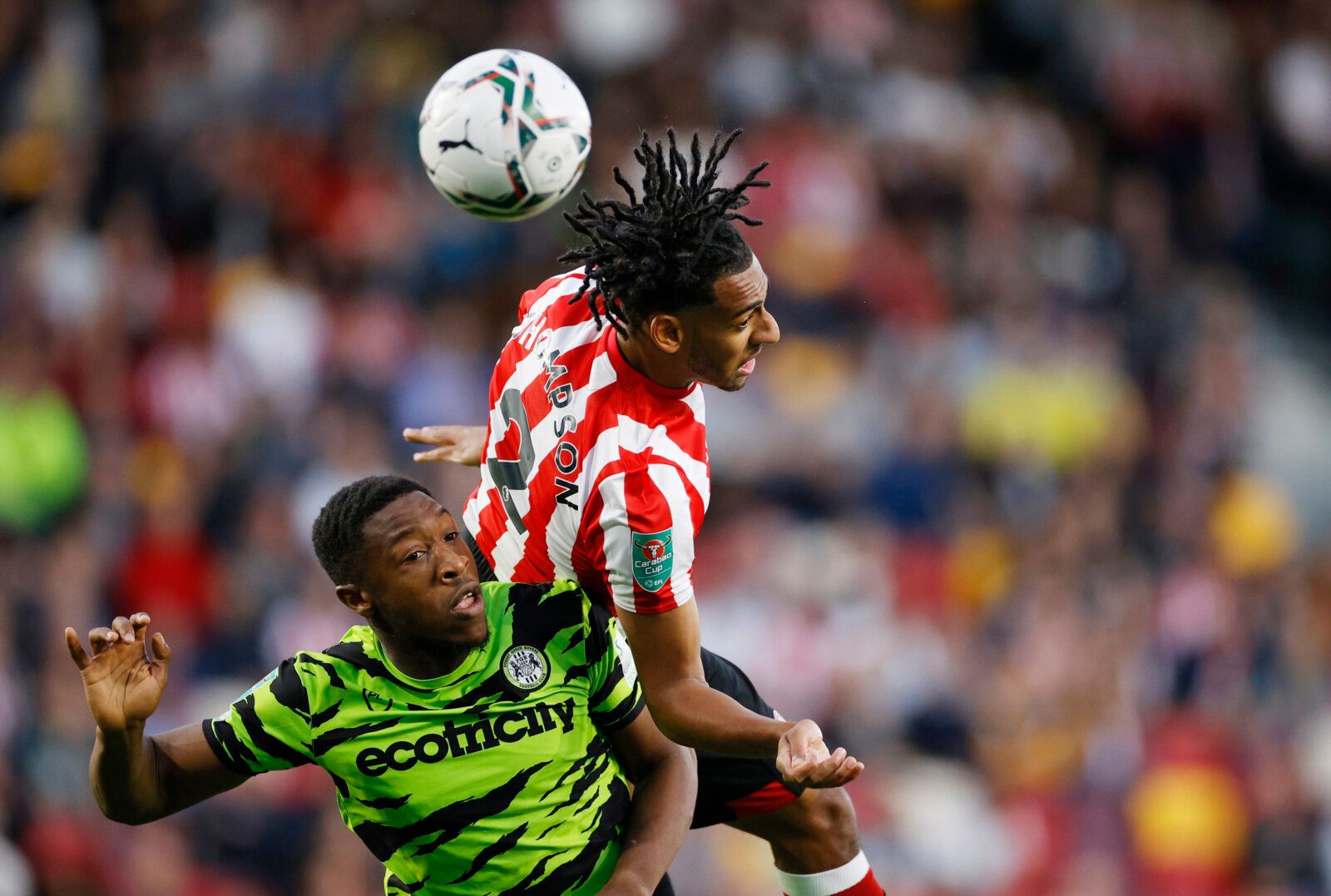 Soccer - England - Carabao Cup Second Round - Brentford v Forest Green Rovers - Community Stadium, London, Britain - August 24, 2021  Brentford's Dominic Thompson in action with Forest Green Rovers' Ebou Adams Action Images via Reuters/John Sibley