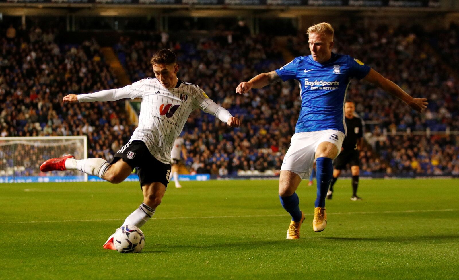 Soccer Football - Championship - Birmingham City v Fulham - St Andrew's, Birmingham, Britain - September 15, 2021  Fulham's Harry Wilson in action with Birmingham City's Kristian Pedersen Action Images/Andrew Boyers  EDITORIAL USE ONLY. No use with unauthorized audio, video, data, fixture lists, club/league logos or 