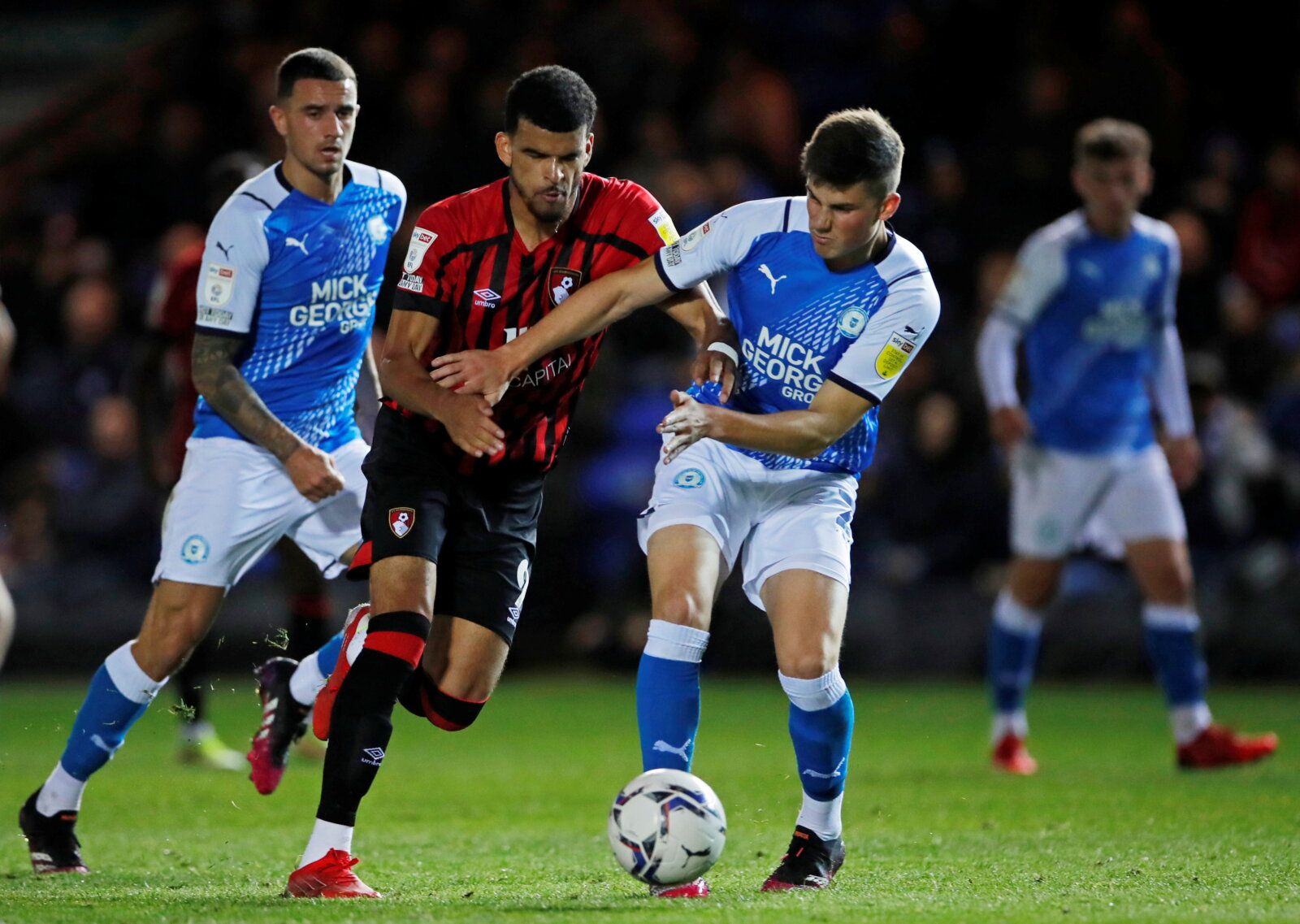 Soccer Football - Championship - Peterborough United v AFC Bournemouth - Weston Homes Stadium, Peterborough, Britain - September 29, 2021  Bournemouth's Dominic Solanke in action with Peterborough United’s Ronnie Edwards Action Images/Andy Couldridge  EDITORIAL USE ONLY. No use with unauthorized audio, video, data, fixture lists, club/league logos or 