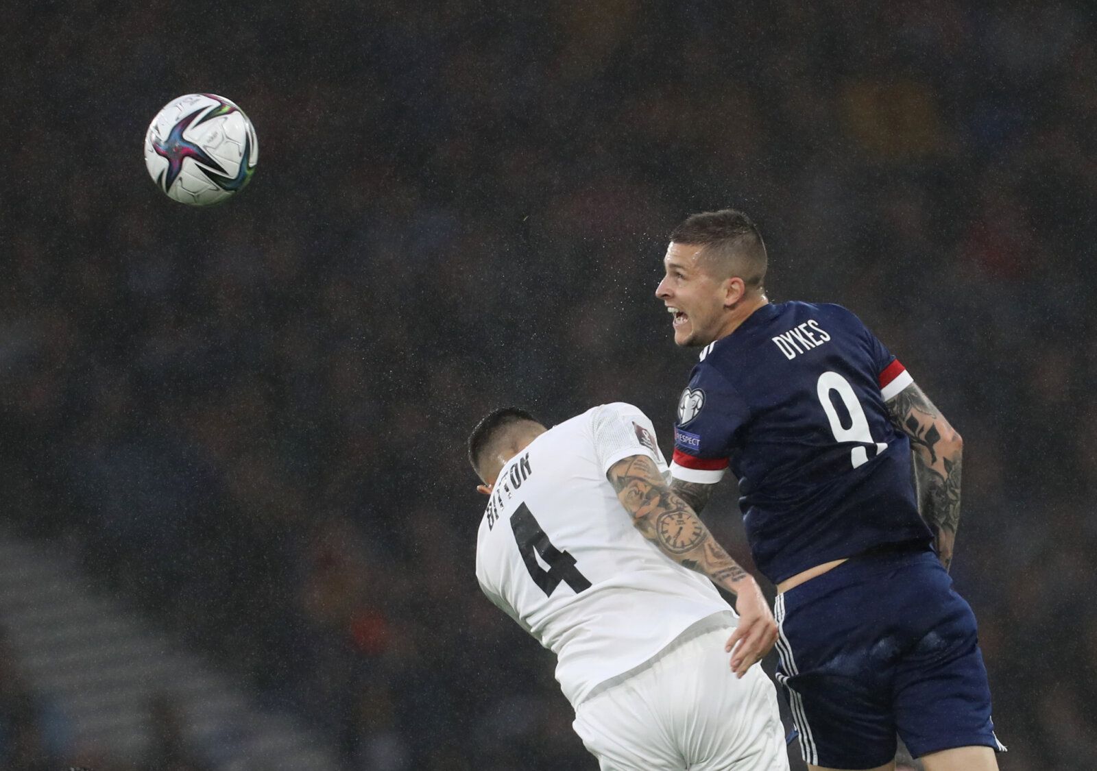 Soccer Football - World Cup - UEFA Qualifiers - Group F - Scotland v Israel - Hampden Park, Glasgow, Scotland, Britain - October 9, 2021   Israel's Nir Bitton in action with Scotland's Lyndon Dykes REUTERS/Russell Cheyne