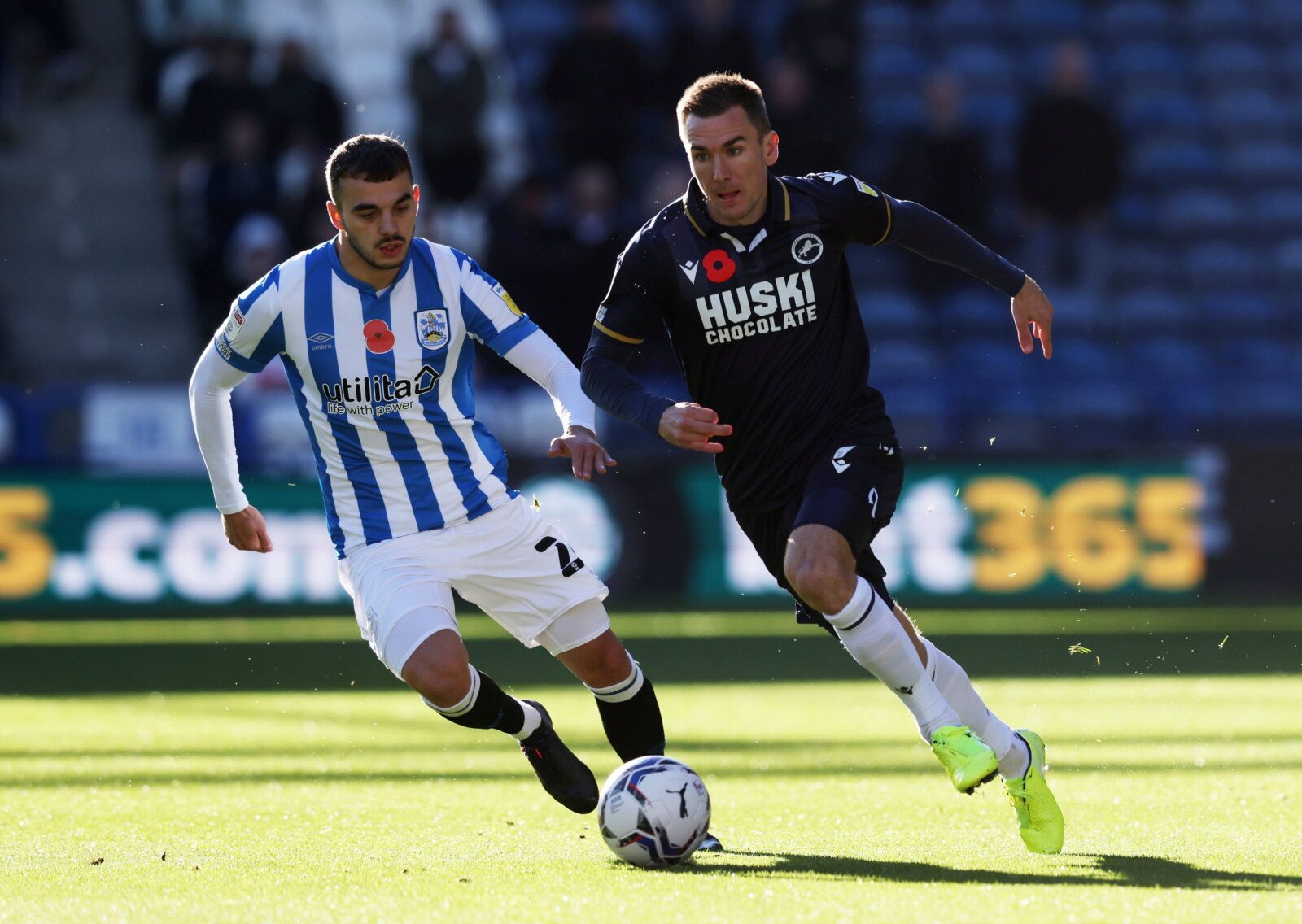 Soccer Football - Championship - Huddersfield Town v Millwall - John Smith's Stadium, Huddersfield, Britain - October 30, 2021 Millwall's Jed Wallace in action with Huddersfield Town's Danel Sinani   Action Images/John Clifton  EDITORIAL USE ONLY. No use with unauthorized audio, video, data, fixture lists, club/league logos or "live" services. Online in-match use limited to 75 images, no video emulation. No use in betting, games or single club/league/player publications.  Please contact your acc