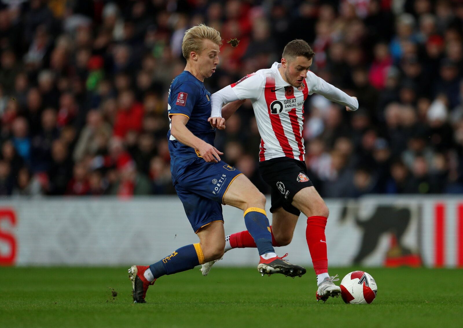 Soccer Football - FA Cup - First Round - Sunderland v Mansfield Town - Stadium of Light, Sunderland, Britain - November 6, 2021 Mansfield Town's Harry Charley in action with Sunderland’s Elliot Embleton  Action Images/Lee Smith