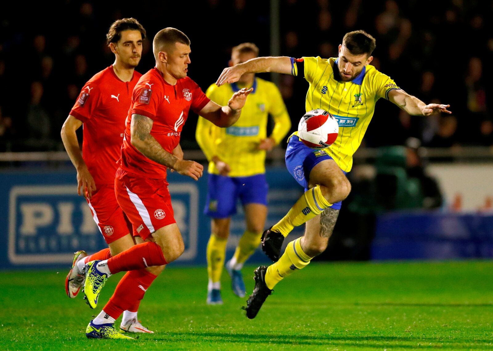 Soccer Football - FA Cup - FA Cup First Round Replay - Solihull Moors v Wigan Athletic - Damson Park, Solihull, Britain - November 16, 2021  Solihull Moors' Danny Newton in action with Wigan Athletic's Max Power    Action Images/Andrew Boyers