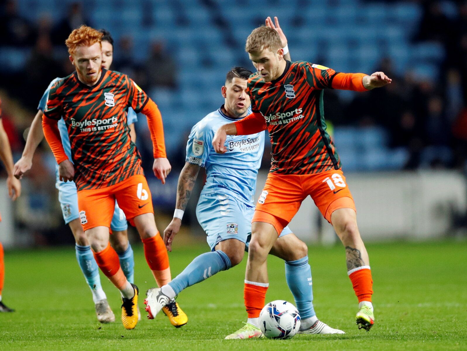 Soccer Football - Championship - Coventry City v Birmingham City - Building Society Arena, Coventry, Britain - November 23, 2021 Coventry City's Gustavo Hamer in action with Birmingham City's Riley McGree   Action Images/Andrew Boyers