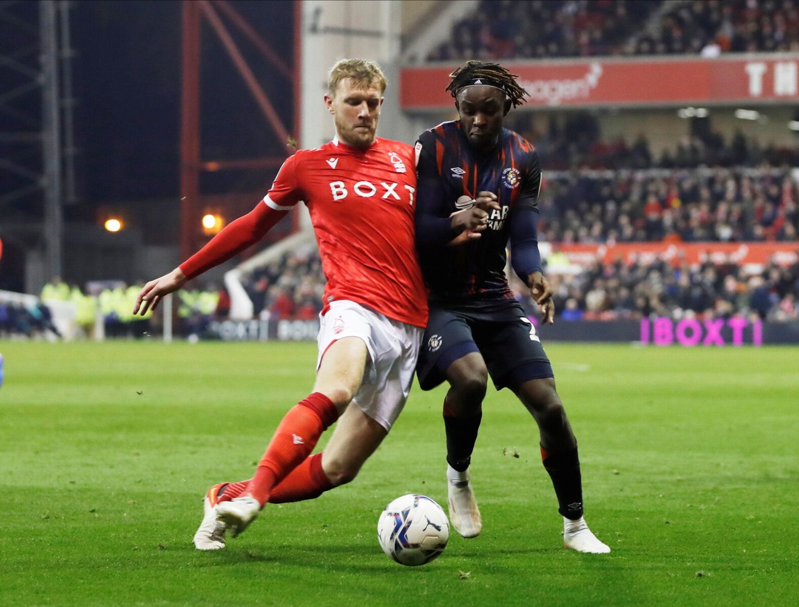 Soccer Football - Championship - Nottingham Forest v Luton Town - The City Ground, Nottingham, Britain - November 23, 2021 Nottingham Forest's Joe Worrall in action with Luton Town's Admiral Muskwe Action Images/Paul Childs