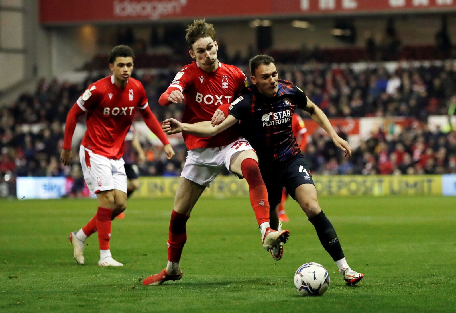 Soccer Football - Championship - Nottingham Forest v Luton Town - The City Ground, Nottingham, Britain - November 23, 2021 Nottingham Forest's James Garner in action with Luton Town's Kal Naismith Action Images/Paul Childs